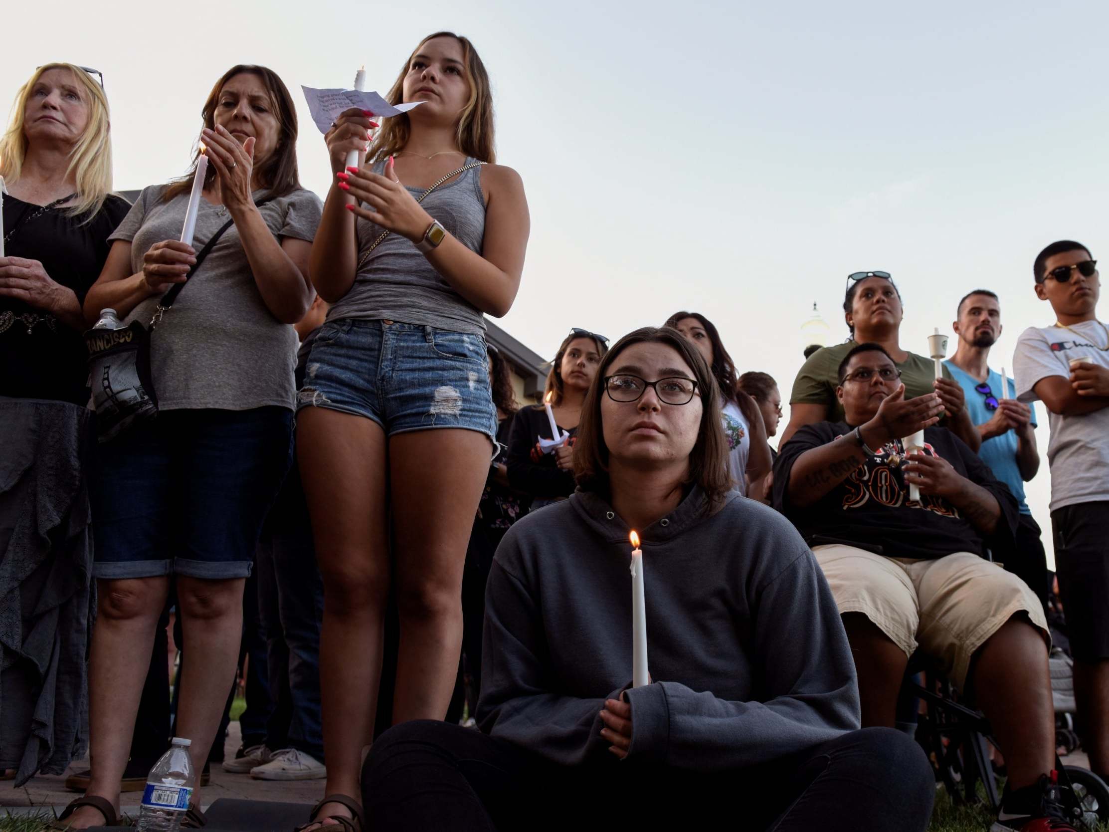 Community members hold a vigil outside Gilroy City Hall