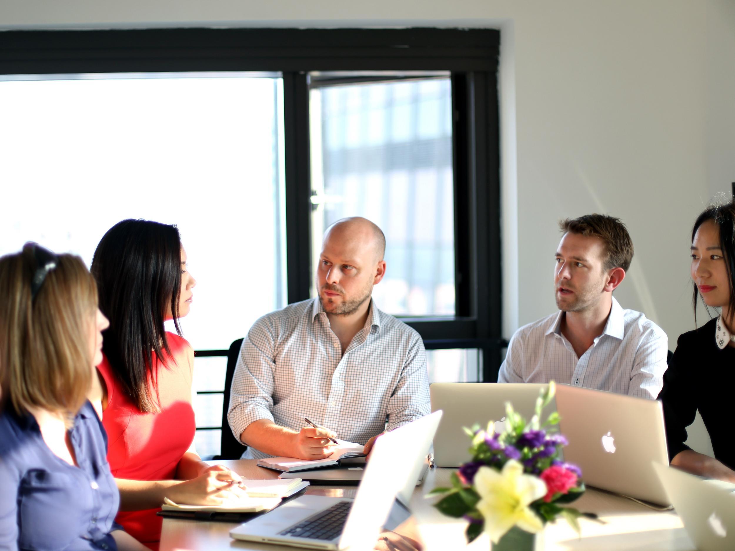 Daniel Nivern (centre) works to place people in the Chinese job market