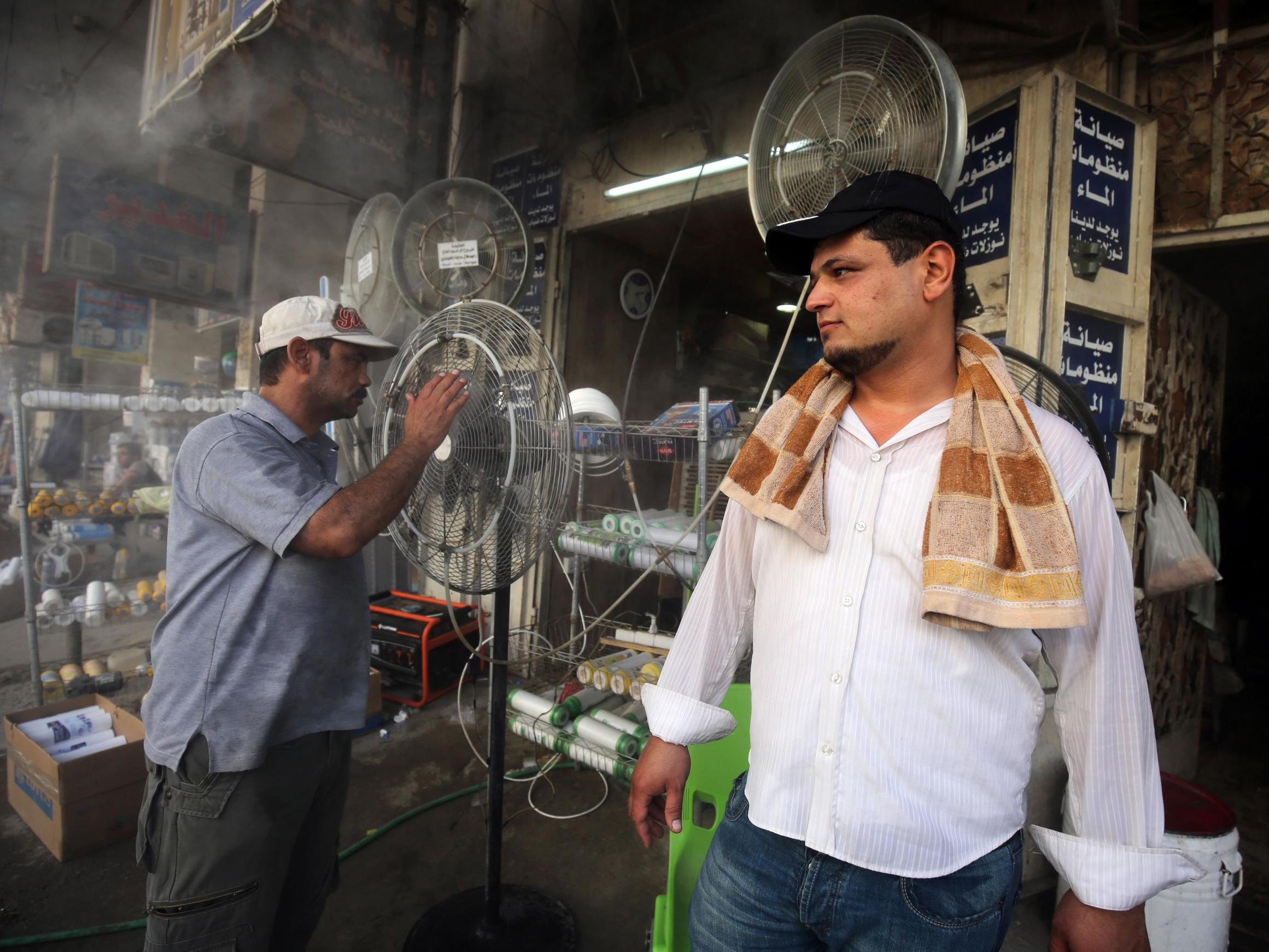 Fans are displayed at a shop selling cooling and ventilation products in Baghdad (AFP/Getty)