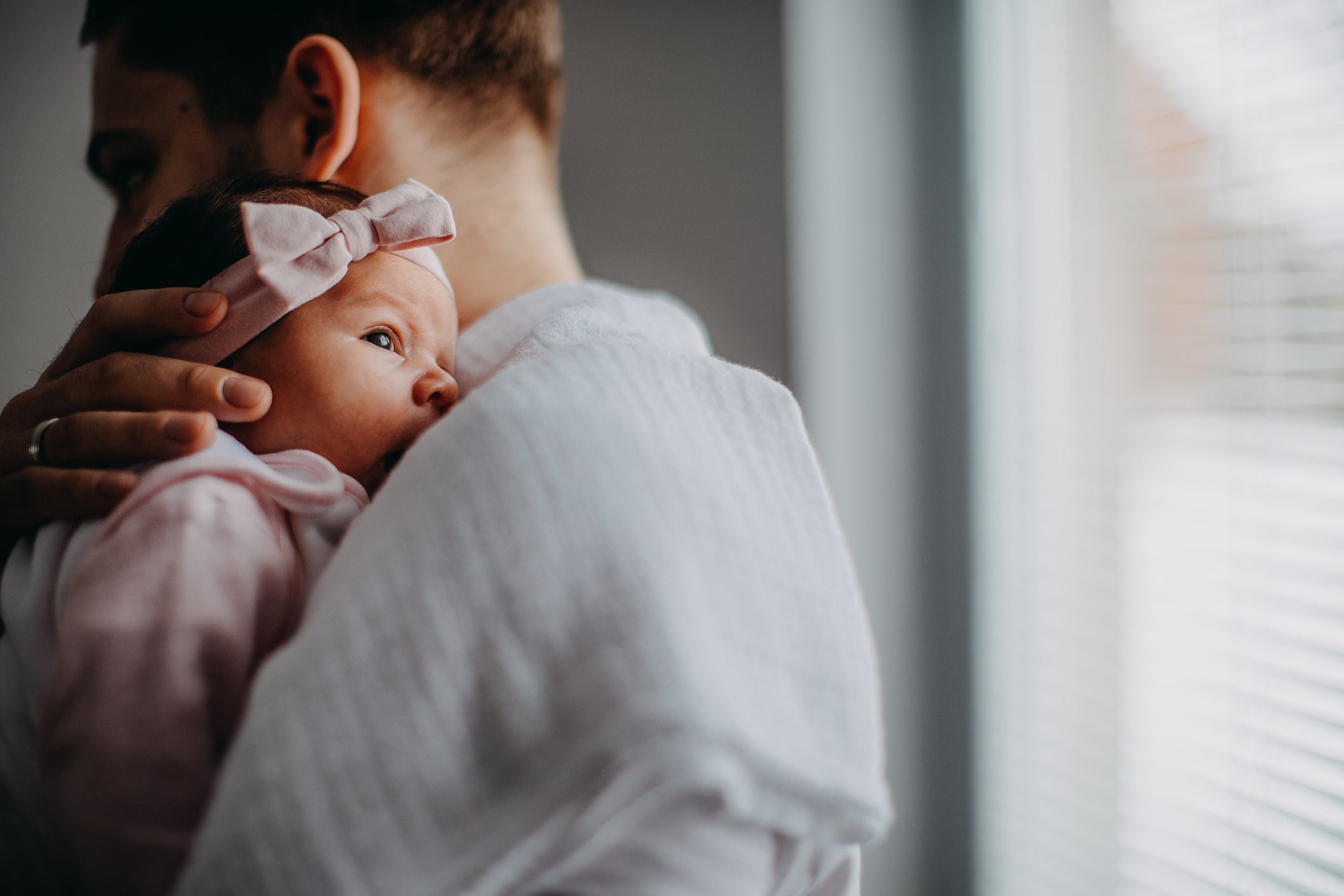 Man with newborn baby