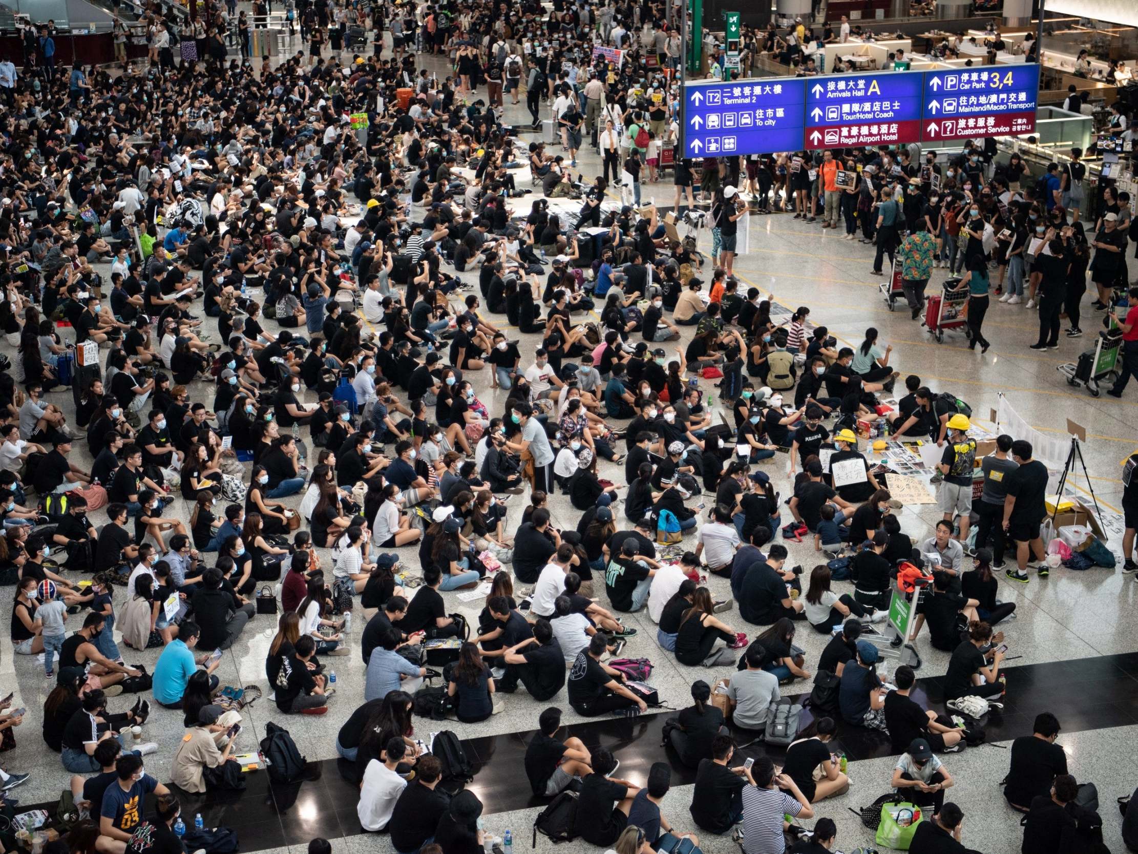 Protesters attend a sit-in at the territory’s international airport on Tuesday