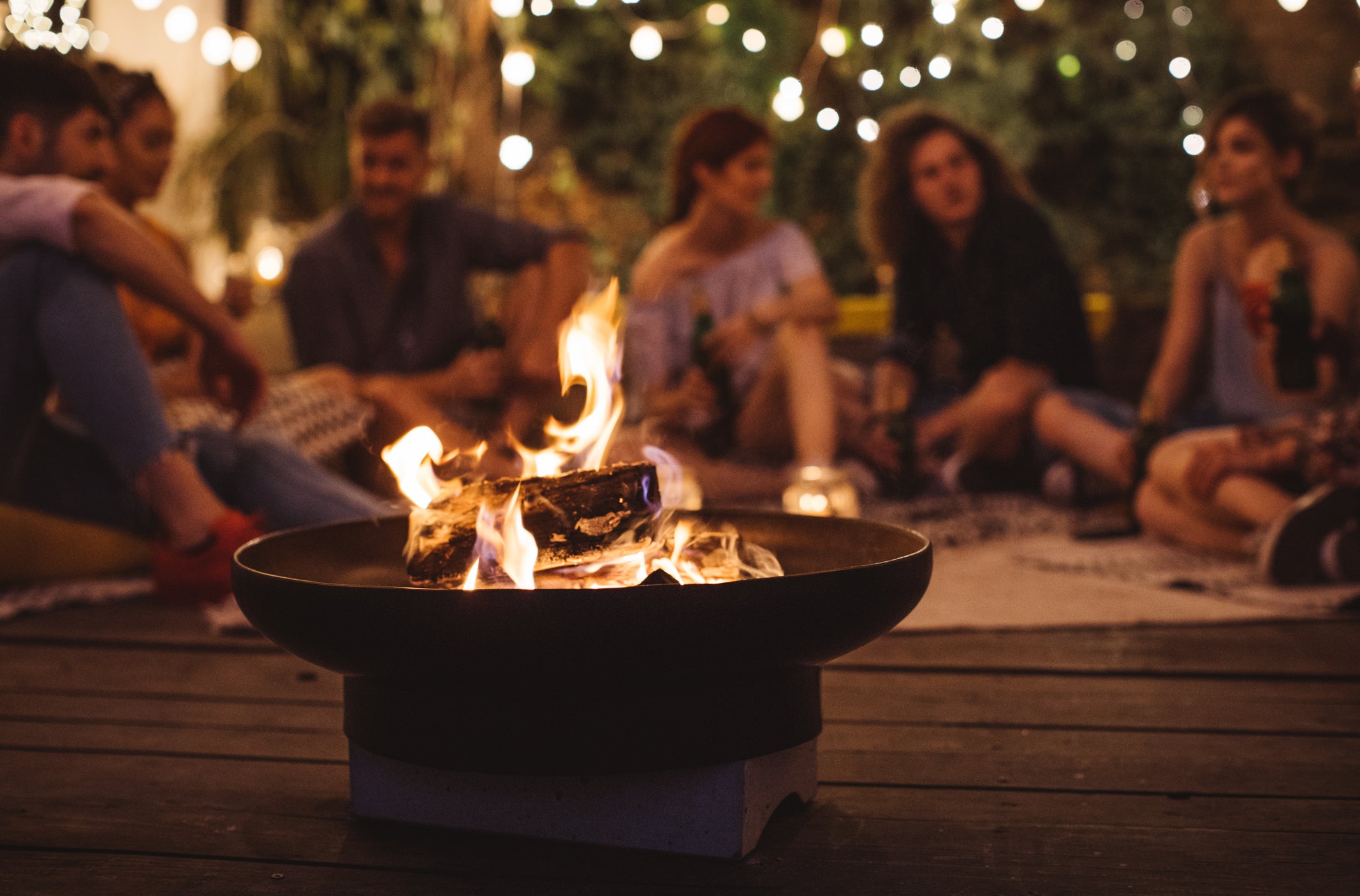 Friends sitting around the fire