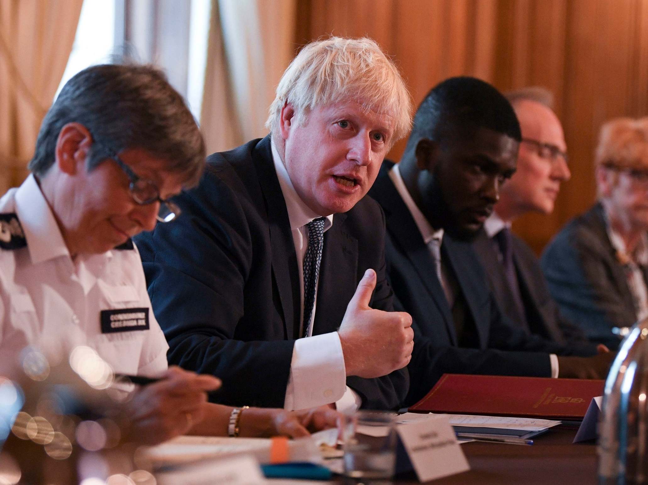 Boris Johnson in Downing Street with Met police commissioner Cressida Dick (left) and Youth Justice Board advisor Roy Sefa-Attakora (3rd right), during a roundtable on crime on 12 August