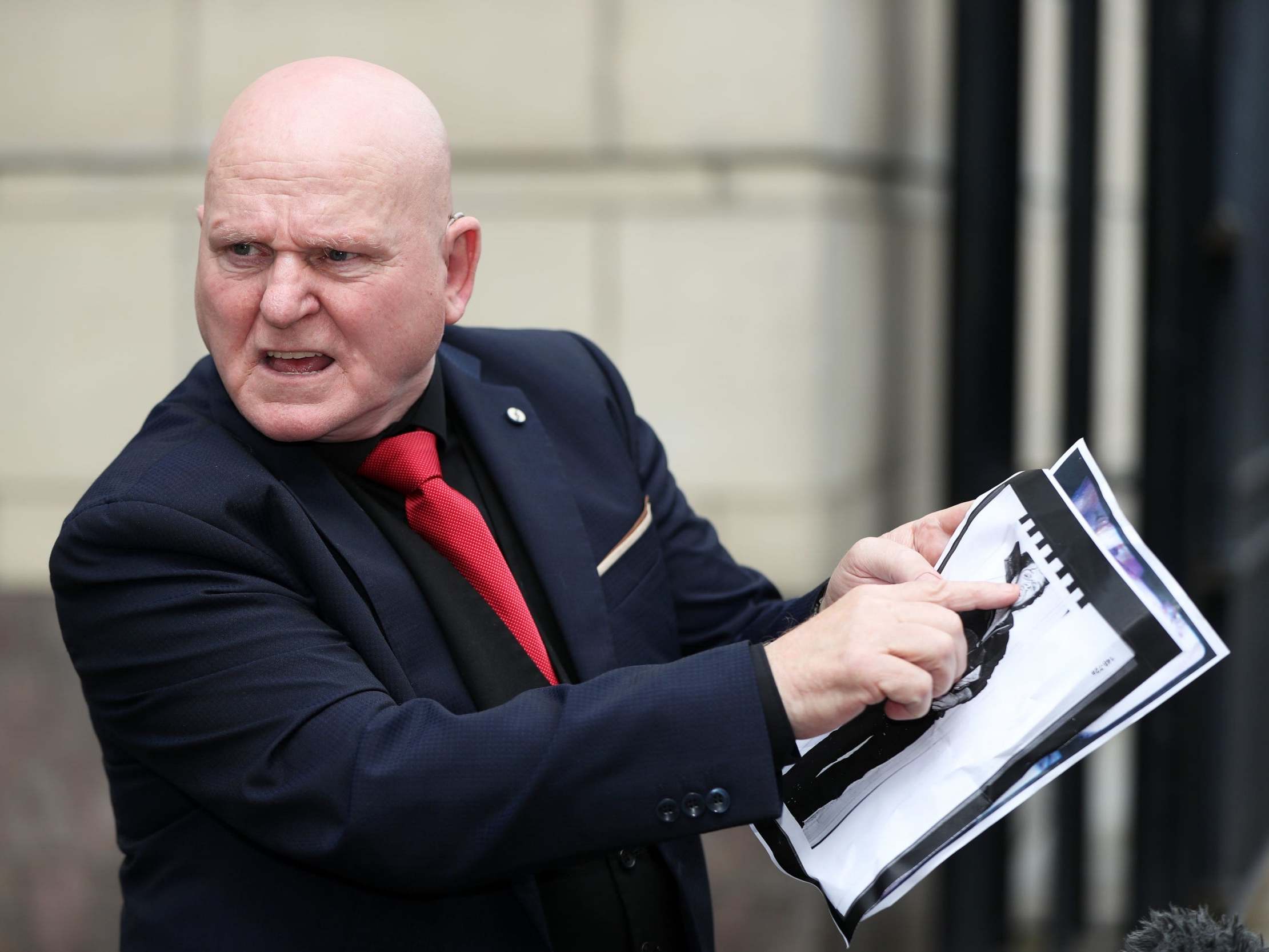 Darren Bradley holds a photograph of his brother Seamus