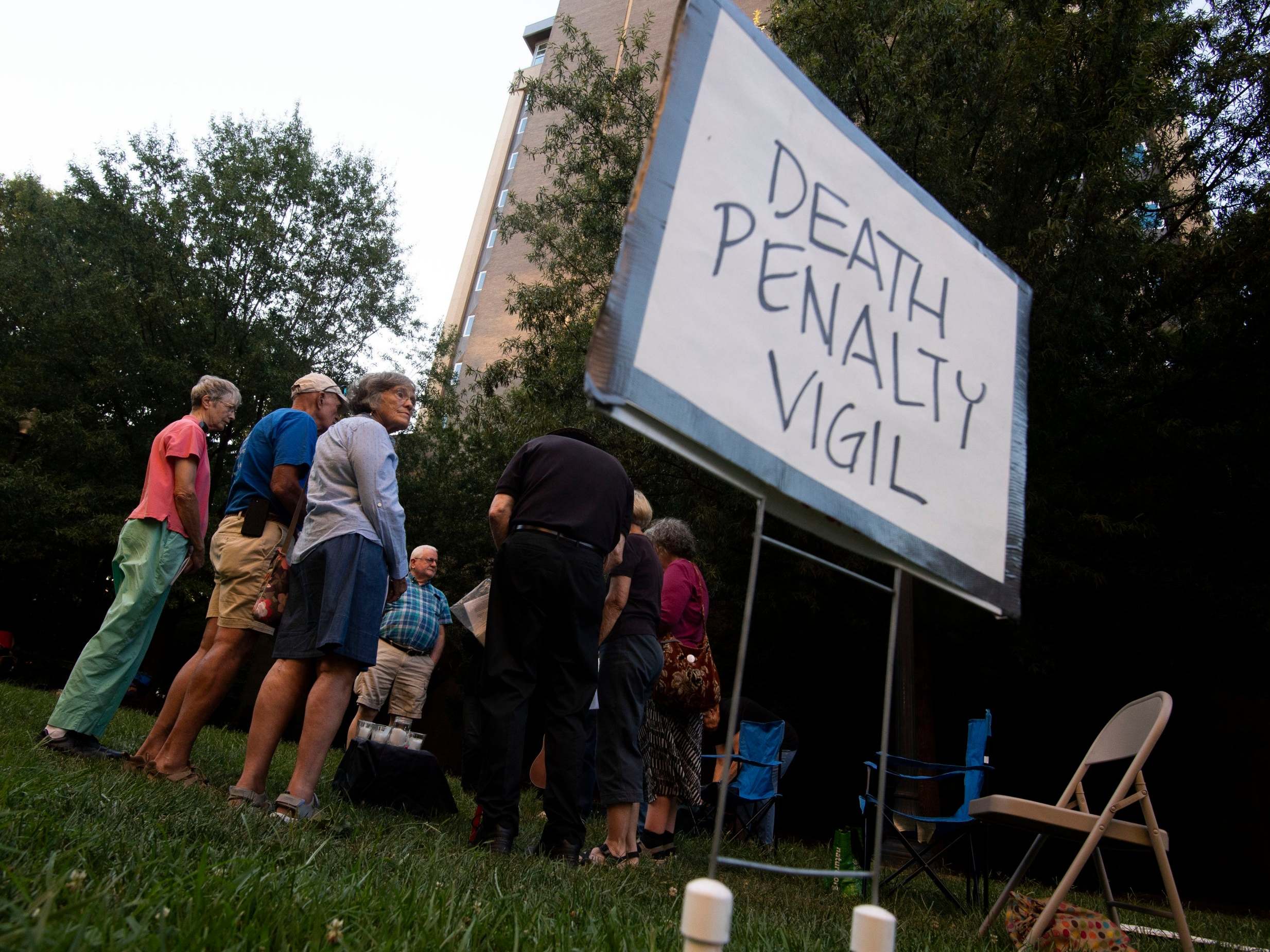 People gather for a candlelight vigil for death row inmate Stephen West