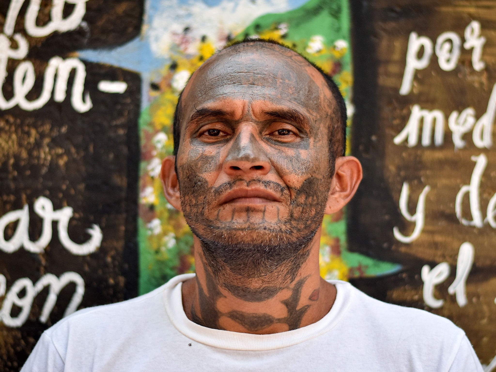 An ex-member of MS-13 is pictured at Santa Ana prison in San Salvador in May 2019. Former members of gangs are willing to endure hours of painful laser technology to remove the tattoos