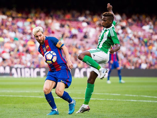 Charly Musonda challenges Lionel Messi while on loan at Real Betis