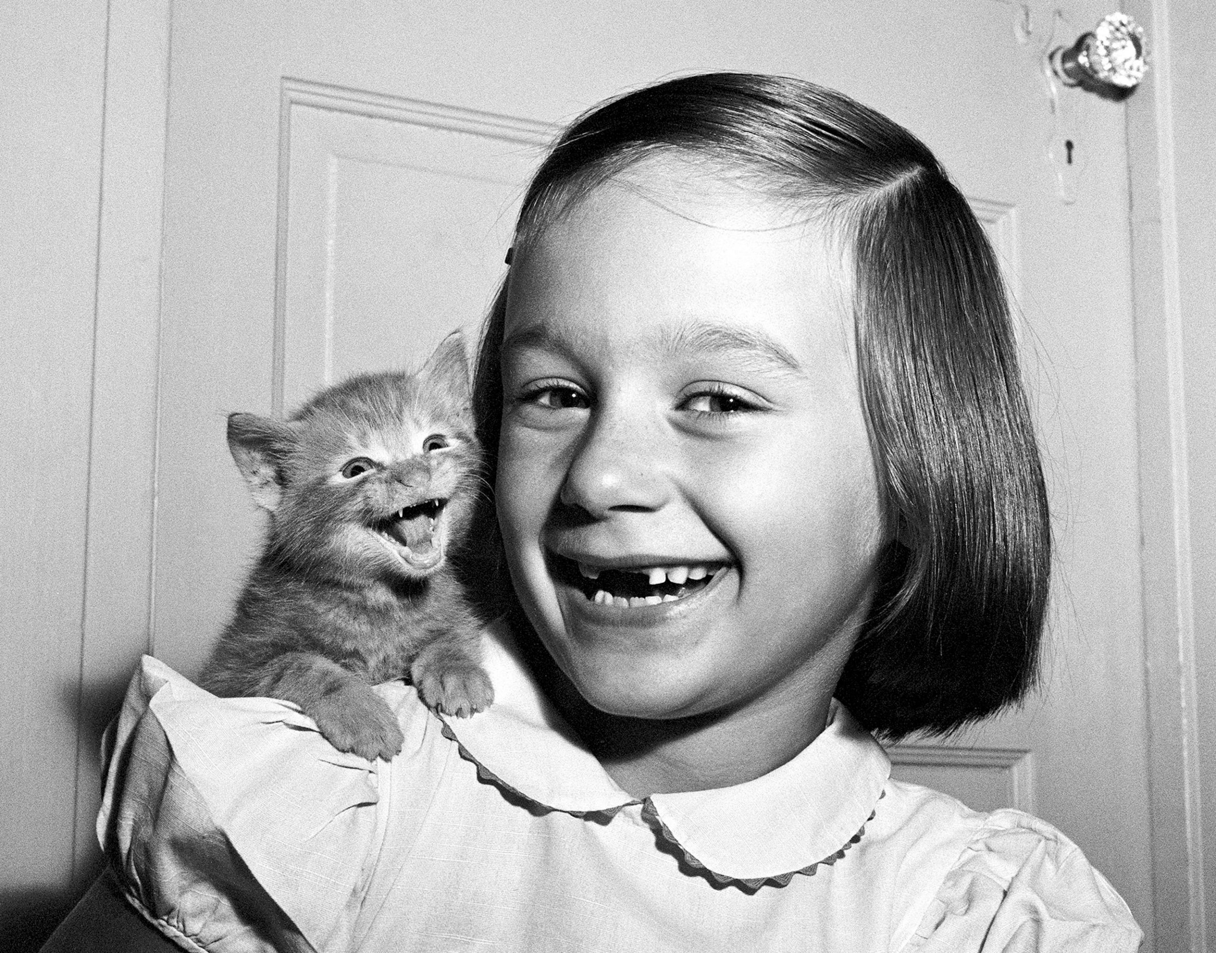 “My daughter Paula and the kitten both ‘smiled’ for the camera at the same time…but the cat’s not smiling, he’s meowing.” — Walter Chandoha. Paula and Kitten is one of Chandoha’s most recognized and perhaps most fortuitously timed photographs, 1955.