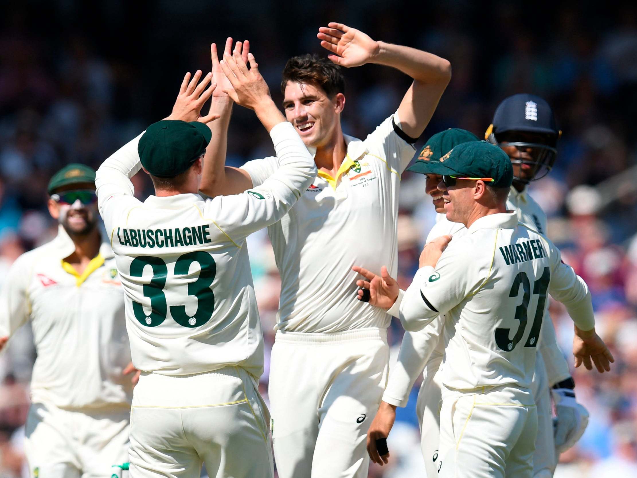 Pat Cummins celebrates with teammates after dismissing Jofra Archer