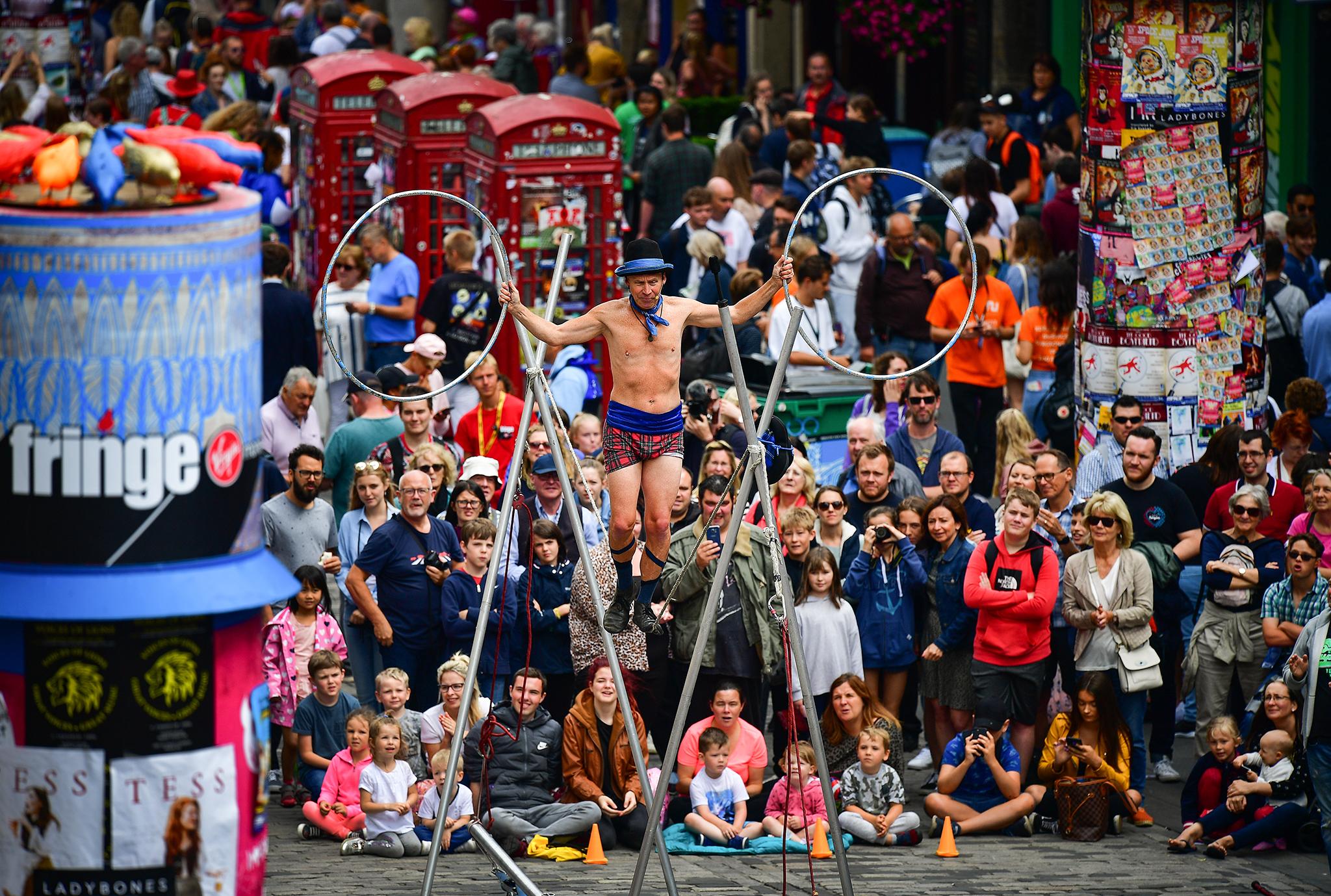 An entertainer performs on the Royal Mile in the Scottish capital