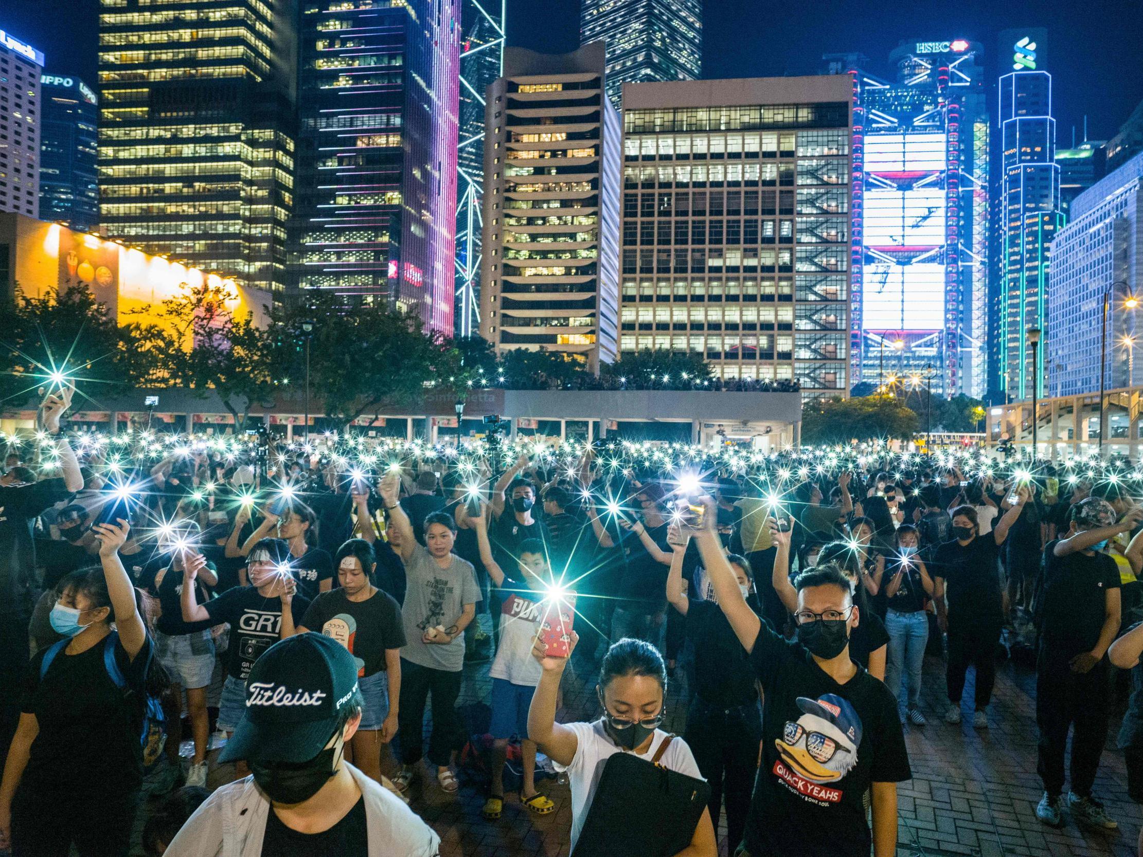 Teenagers sing 'Do You Hear...' at a rally in Hong Kong on 22 August