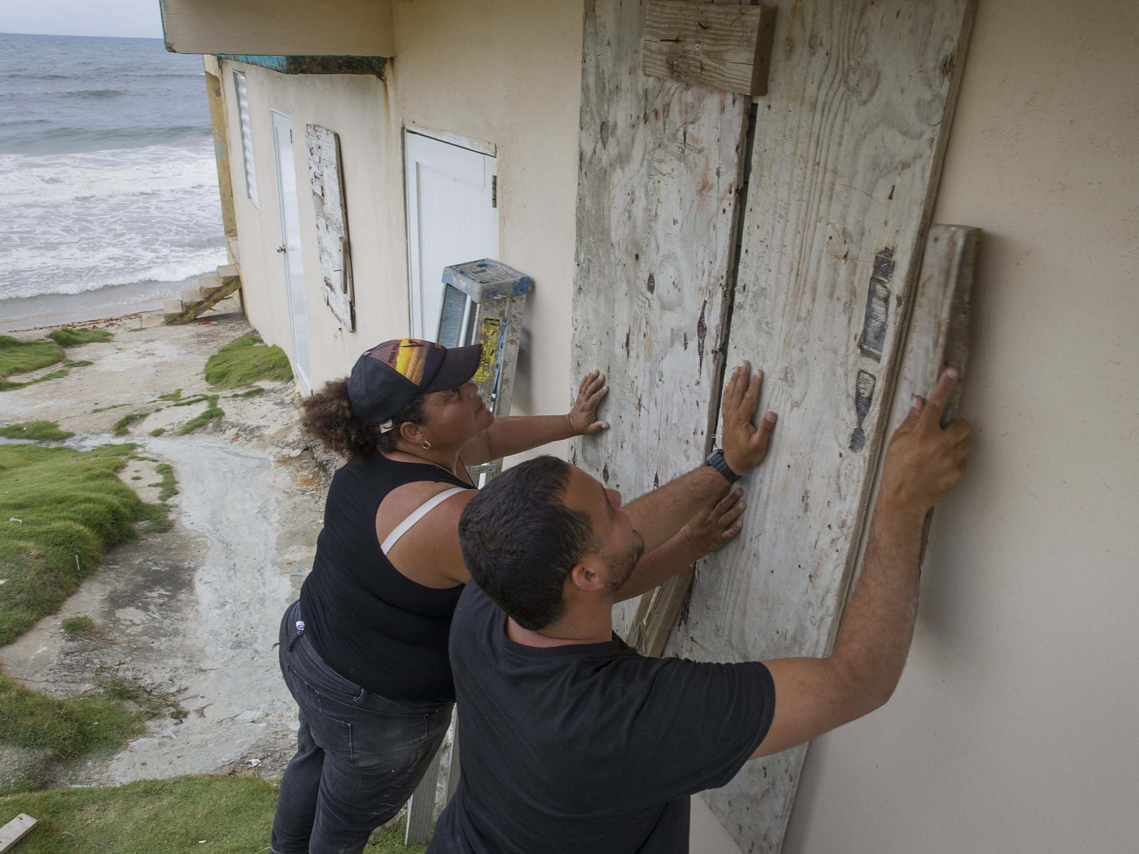 Puerto Rico residents board up their home ahead of Storm Dorian's arrival