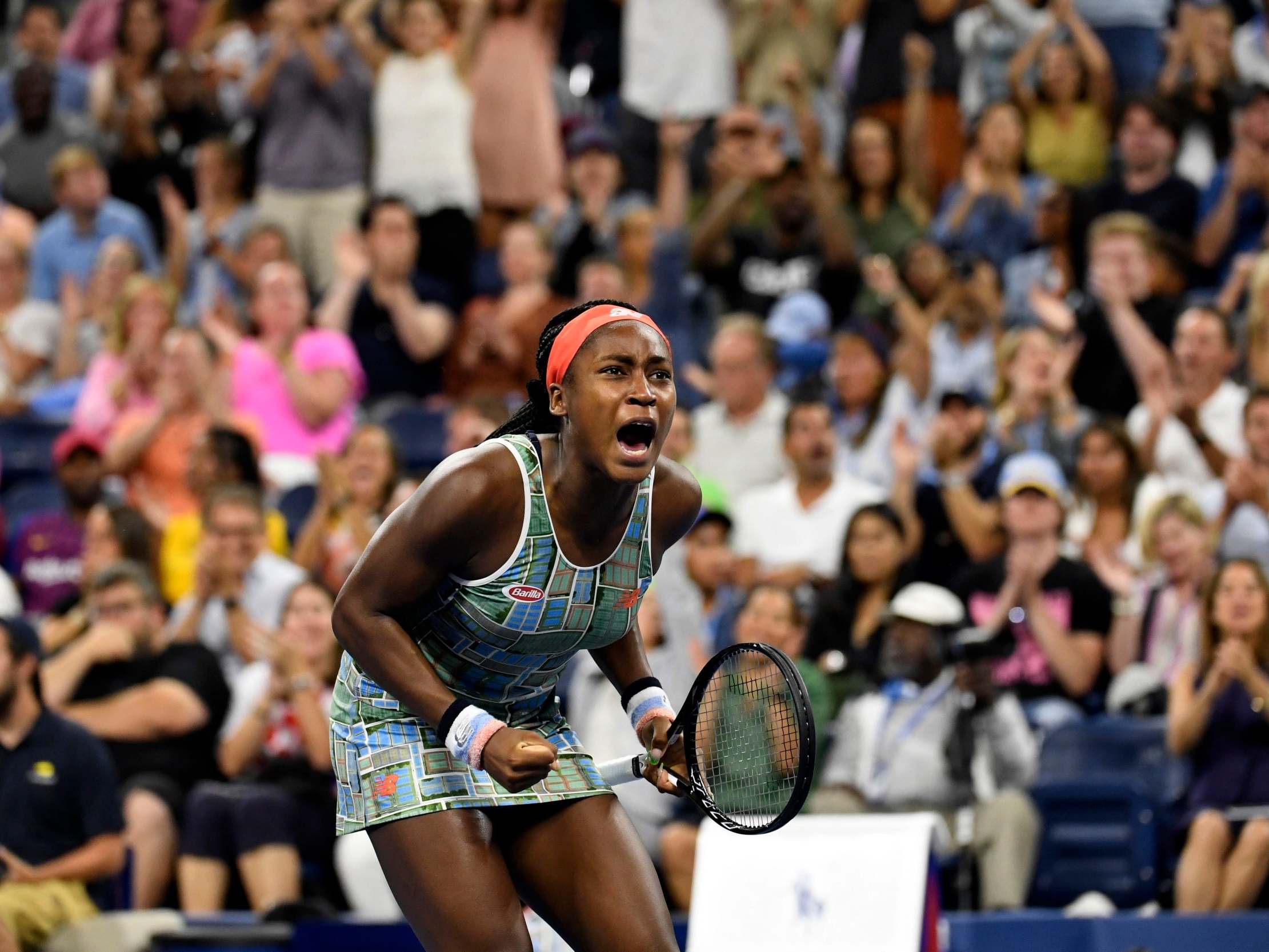 Coco Gauff celebrates winning a point during the third set