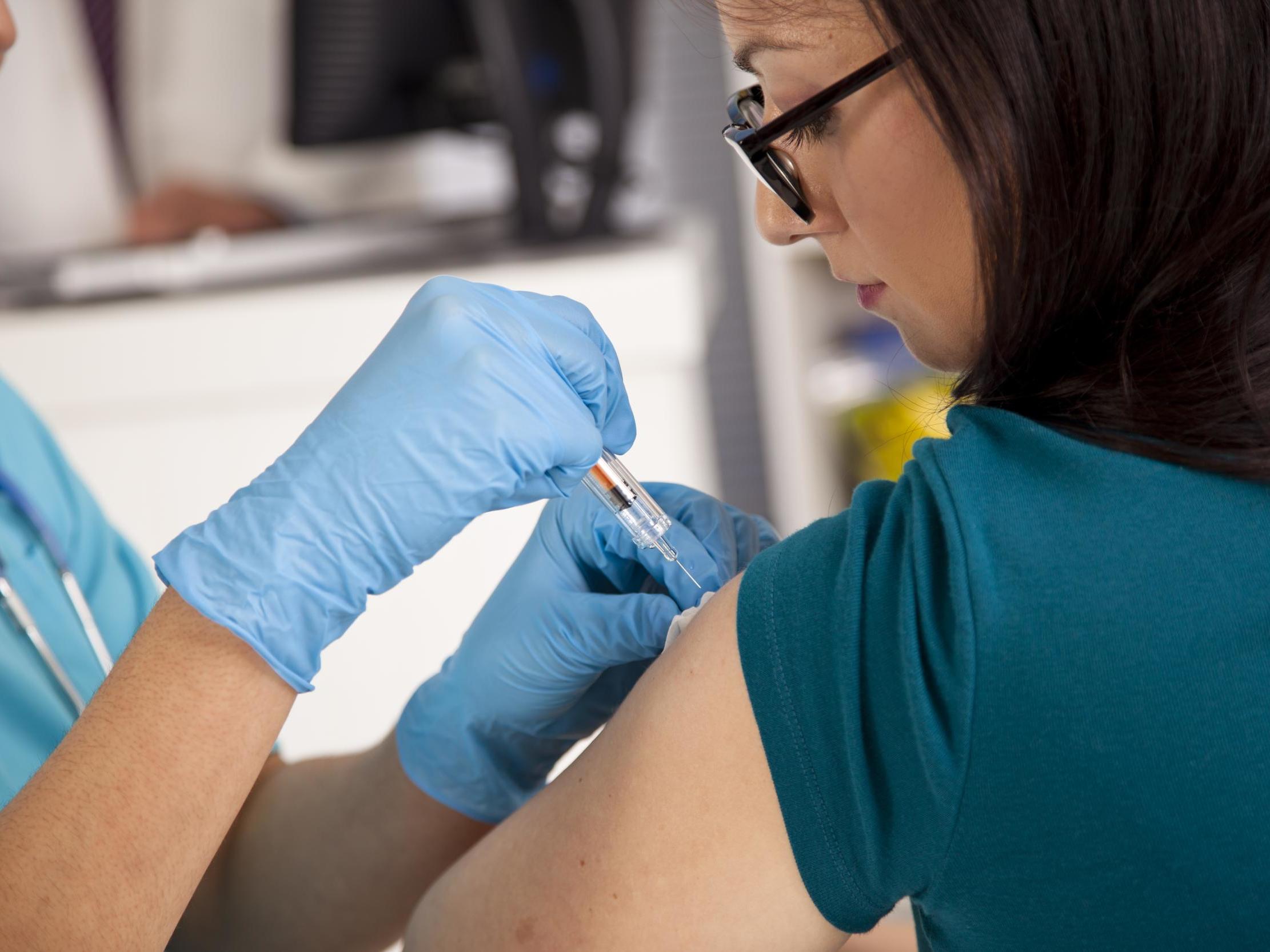 File image of patient receiving flu vaccination.