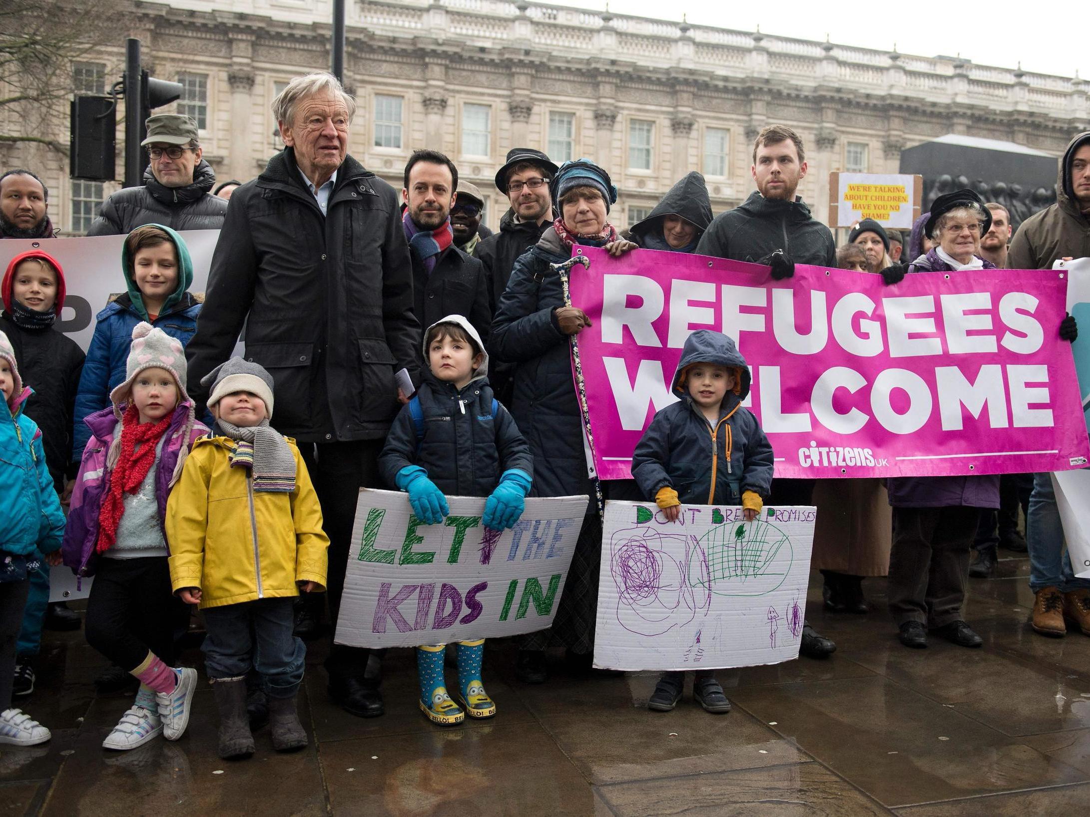 People gather to hear speeches on Whitehall before Lord Dubs hands a petition in to No 10 calling on the PM to keep the Dubs scheme open in 2017 (AFP/Getty)