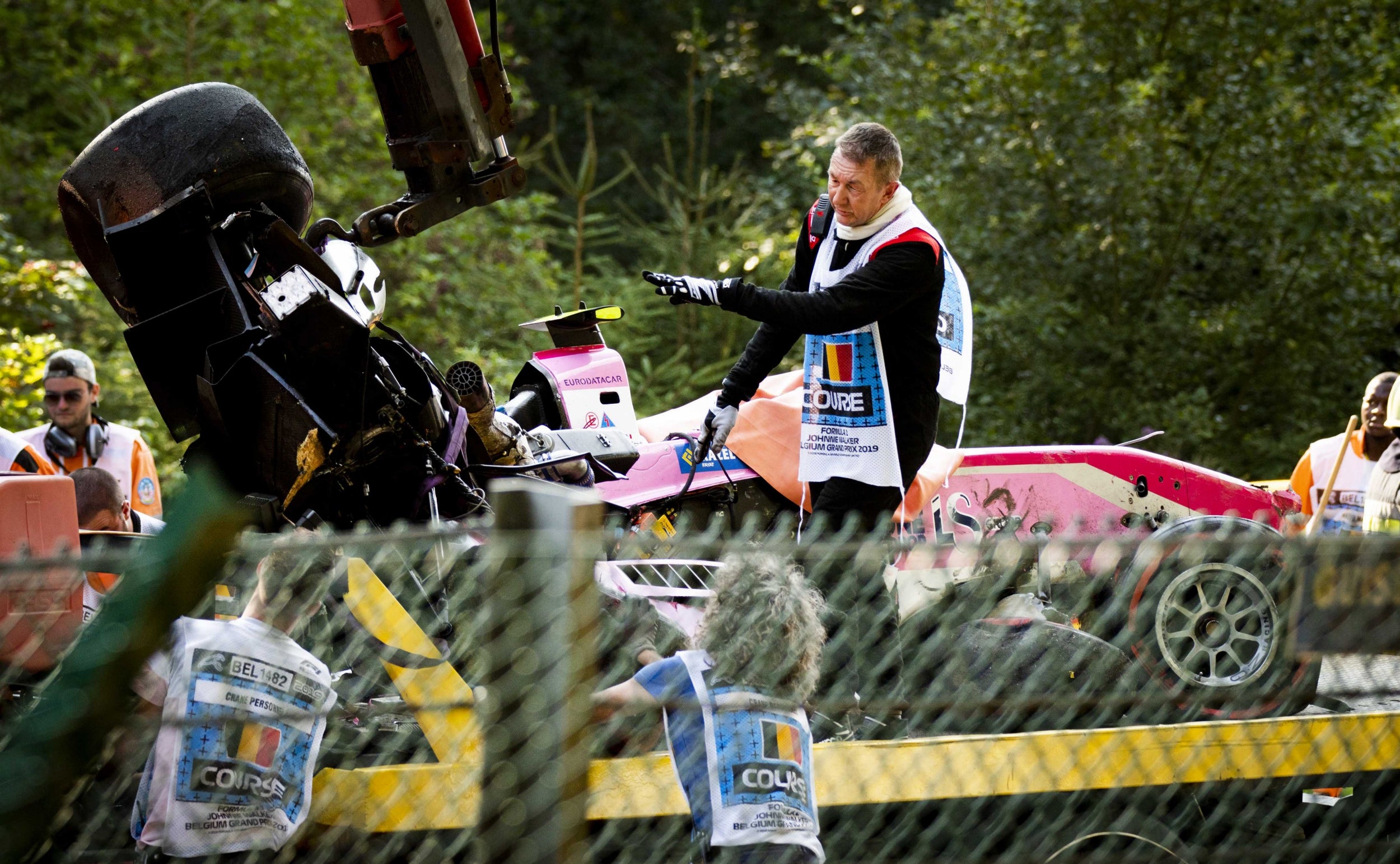 The wreckage of Hubert’s BWT Arden is lifted onto a truck