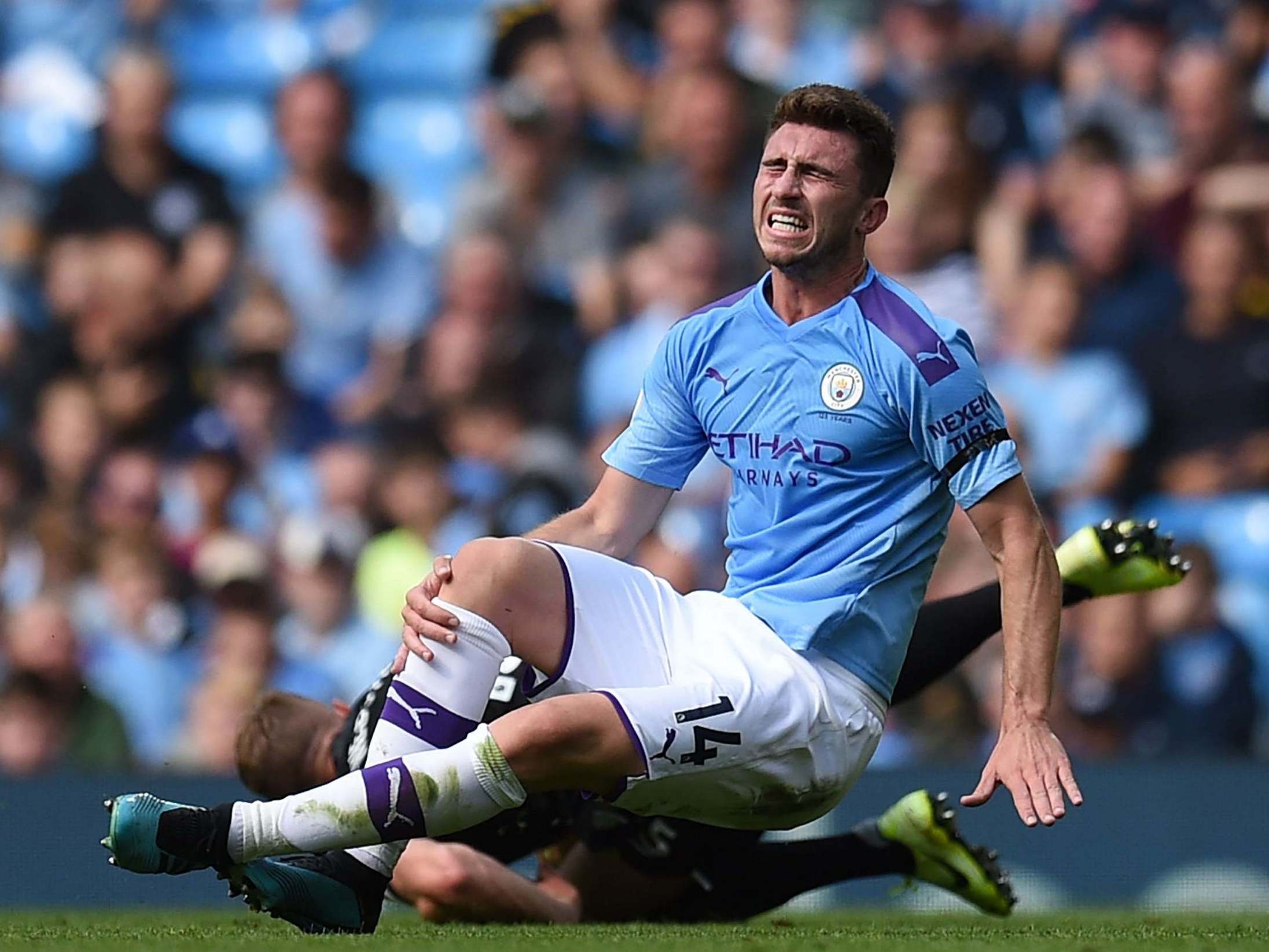 Aymeric Laporte was injured in a challenge by Brighton’s Adam Webster