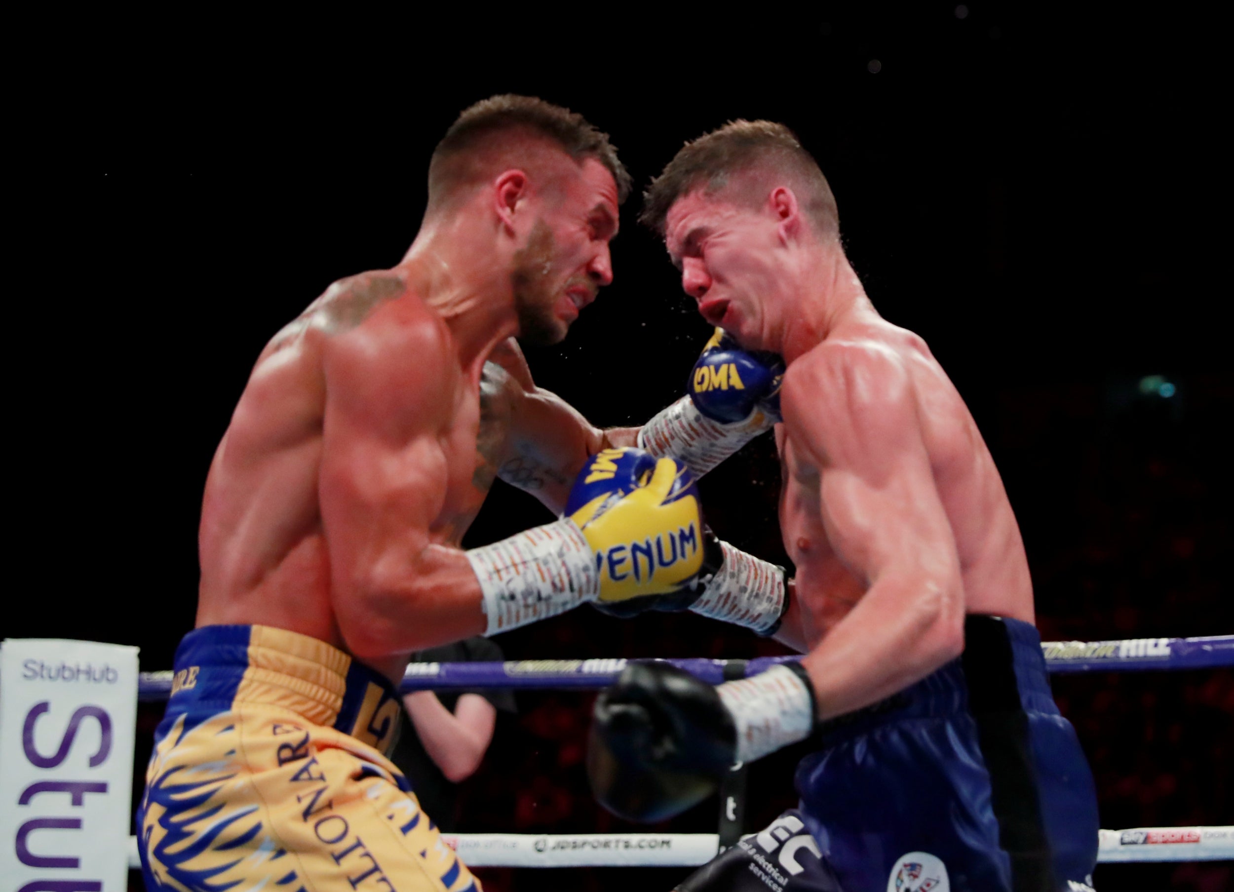 The two exchanged crushing shots throughout the fight (Reuters)