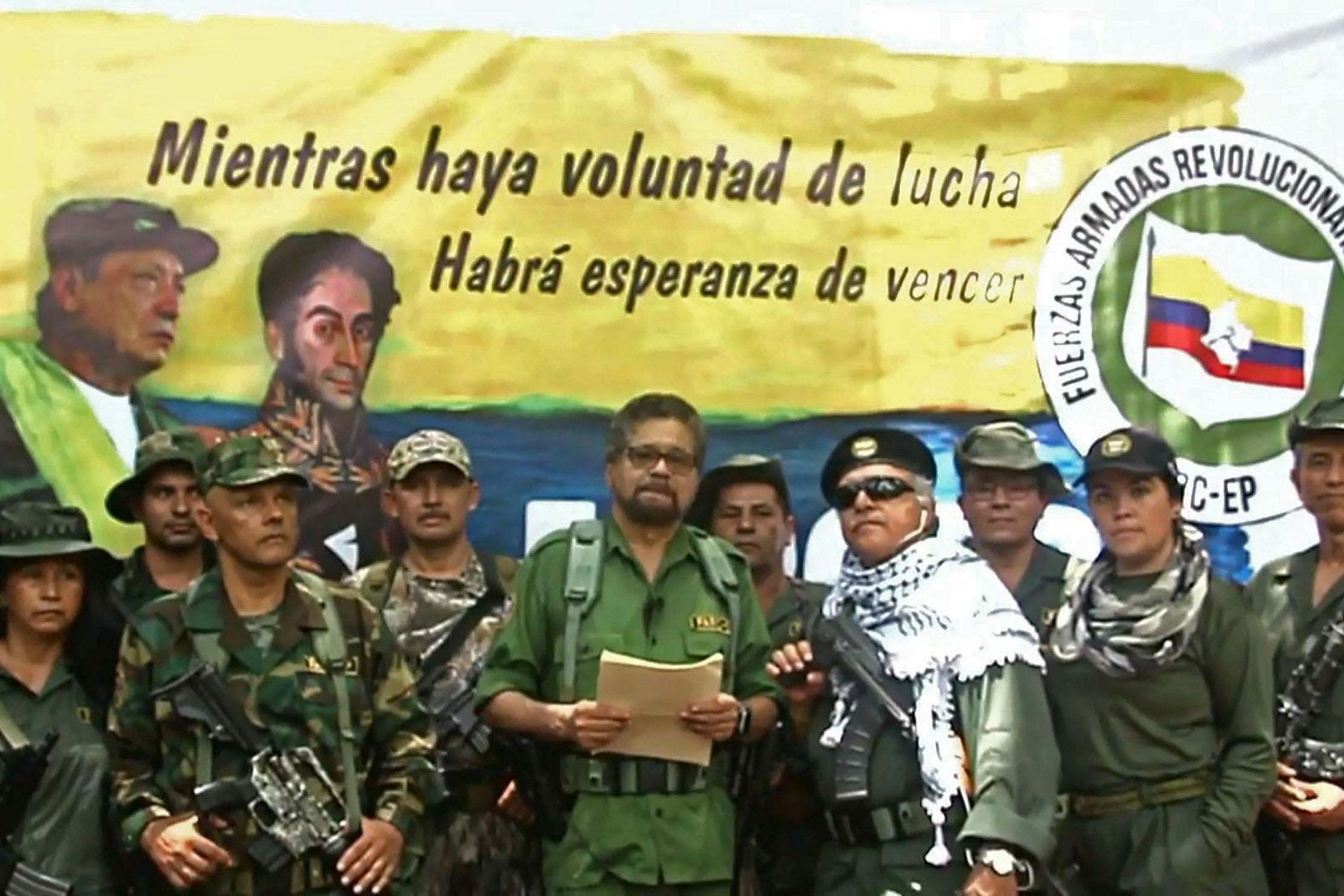 Ivan Marquez (holding a document) and fugitive rebel colleague, Jesus Santrich (in sunglasses), announce they are taking up arms again