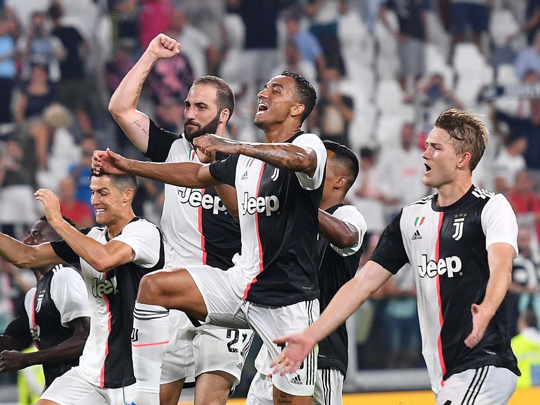 Juventus celebrate their late victory over Napoli