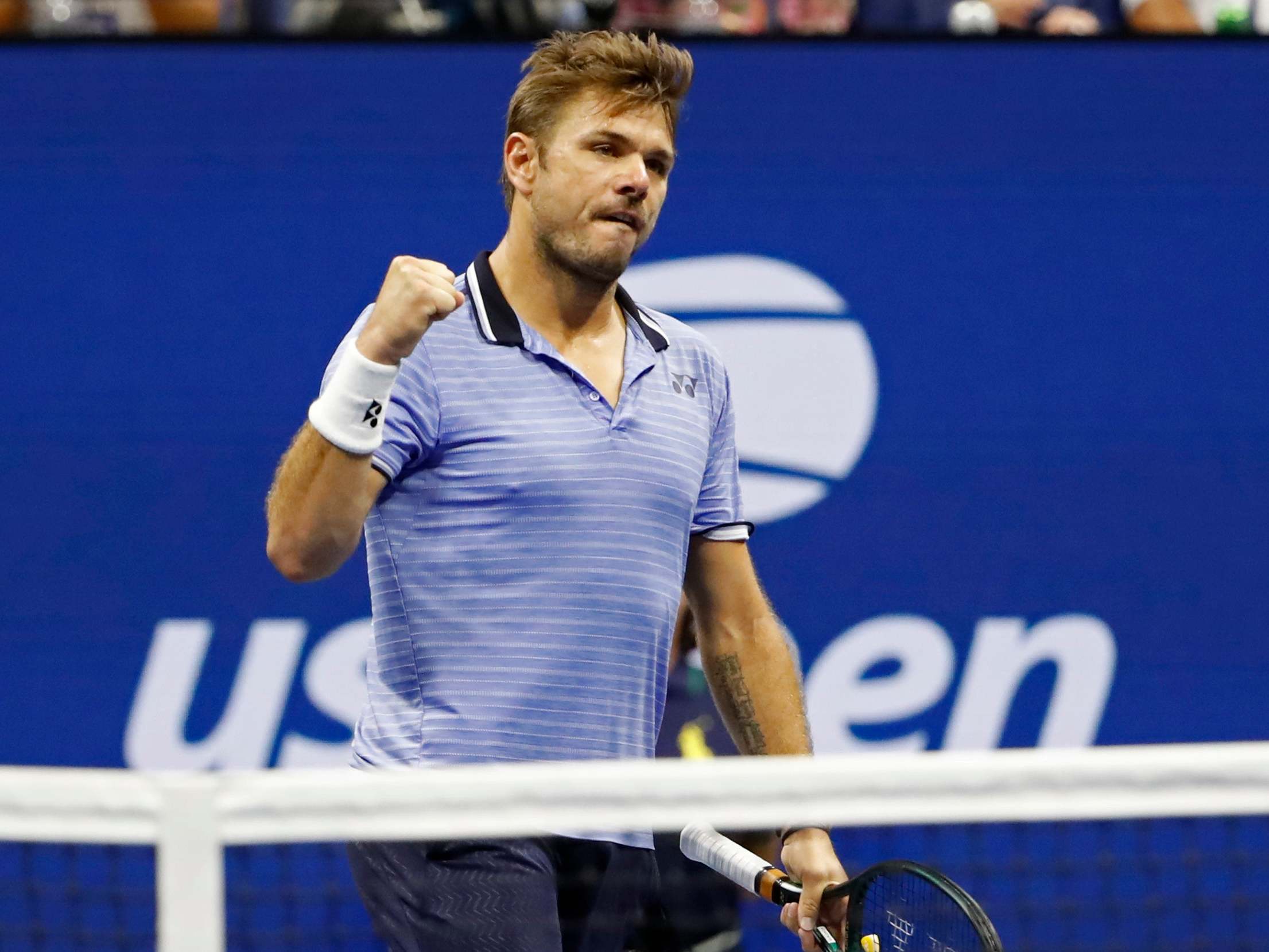 Wawrinka celebrates his victory over Djokovic