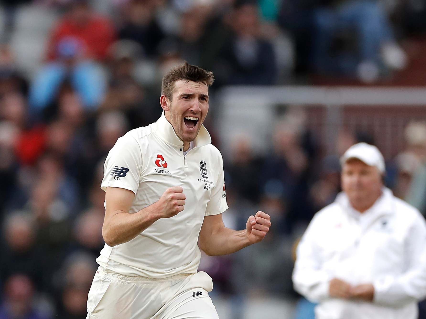 Craig Overton celebrates taking the wicket of Marnus Labuschagne