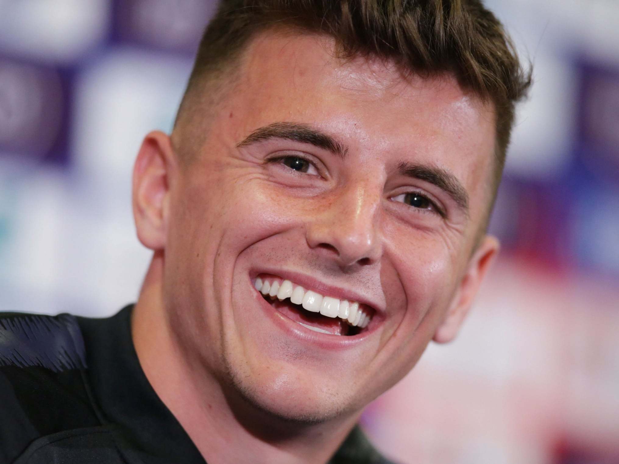 Mason Mount laughs during an England press conference