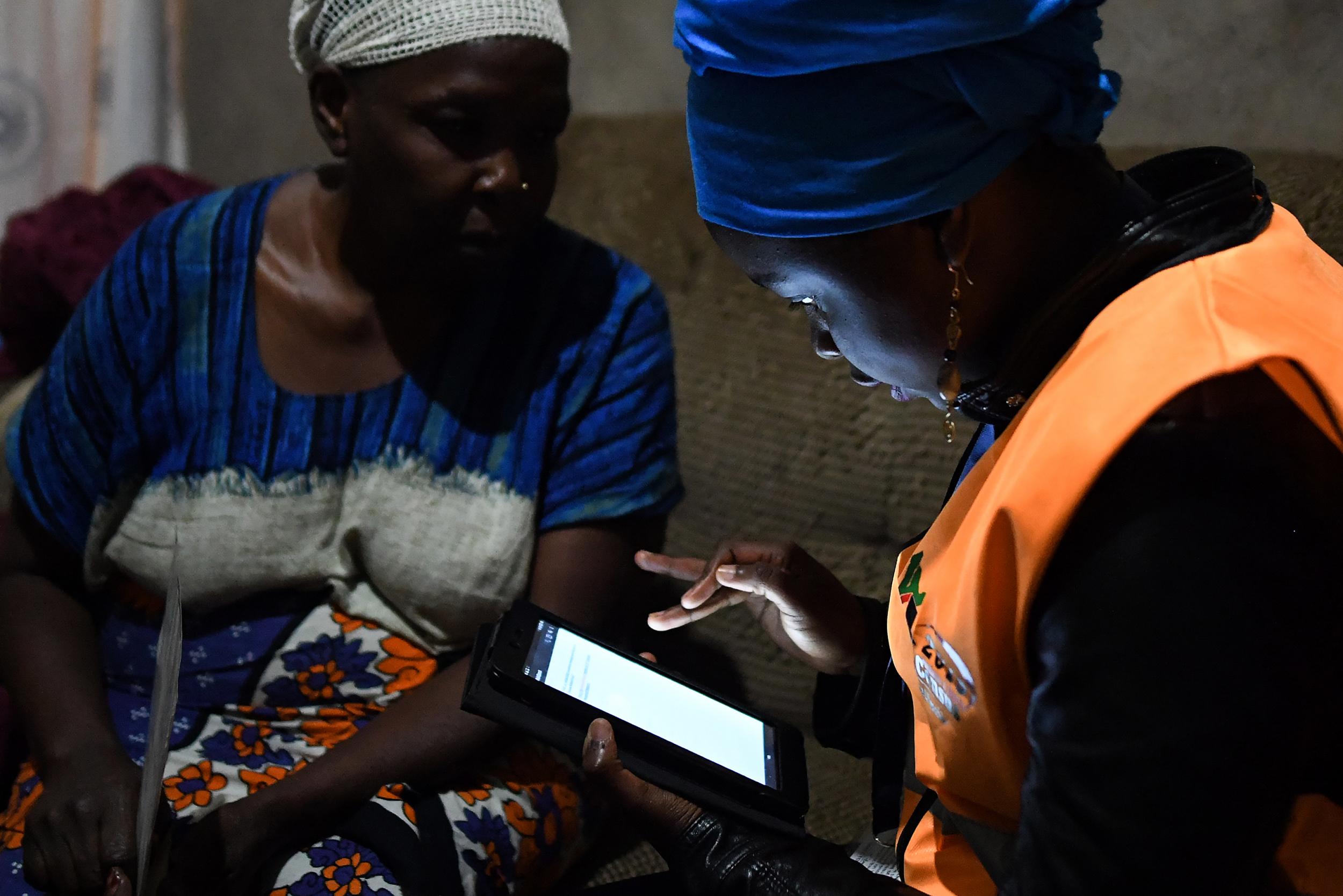 Progress: a woman answers questions in the 2019 population census in Nairobi