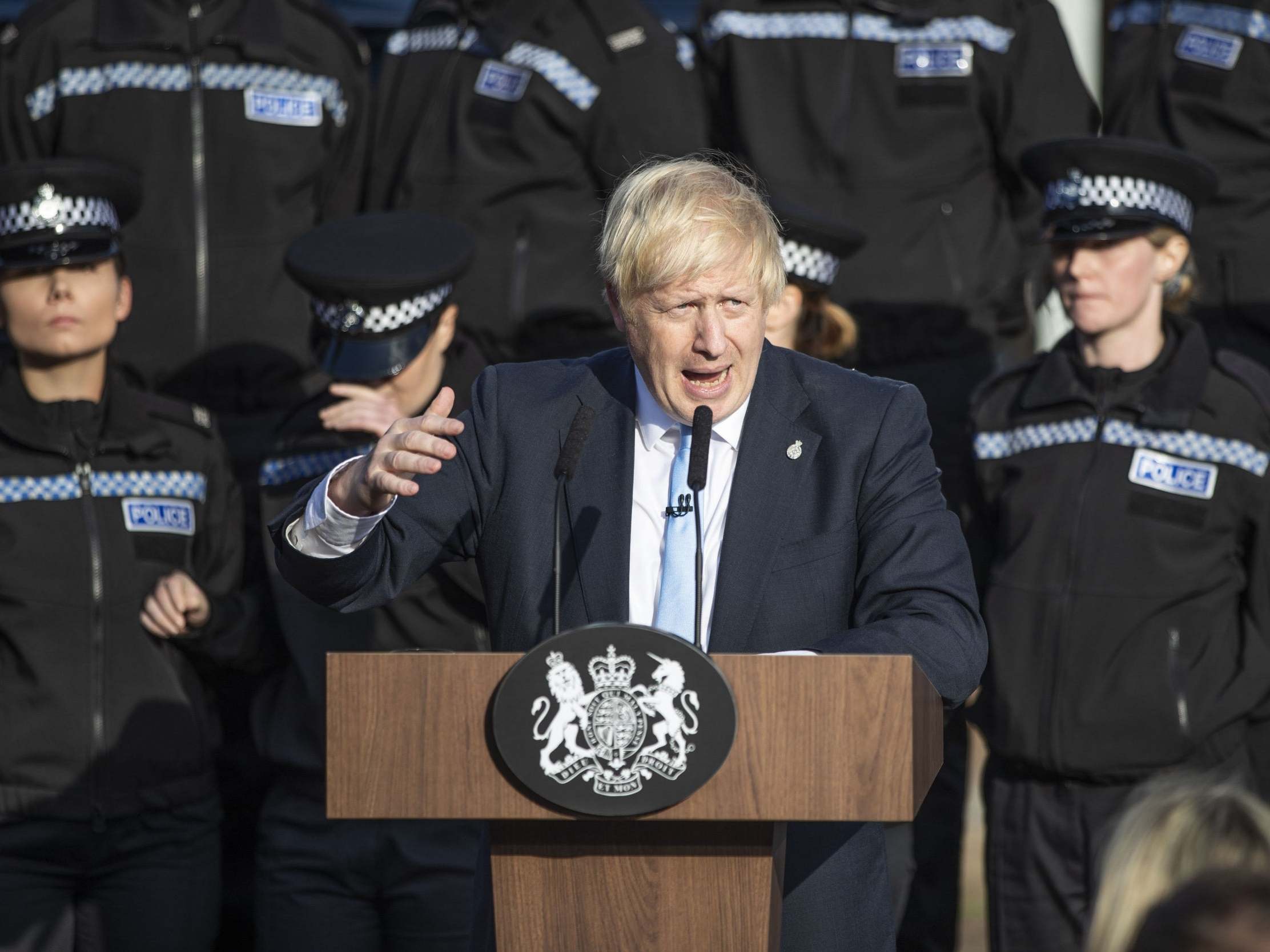 The prime minister gives a speech in Wakefield against a backdrop of officers