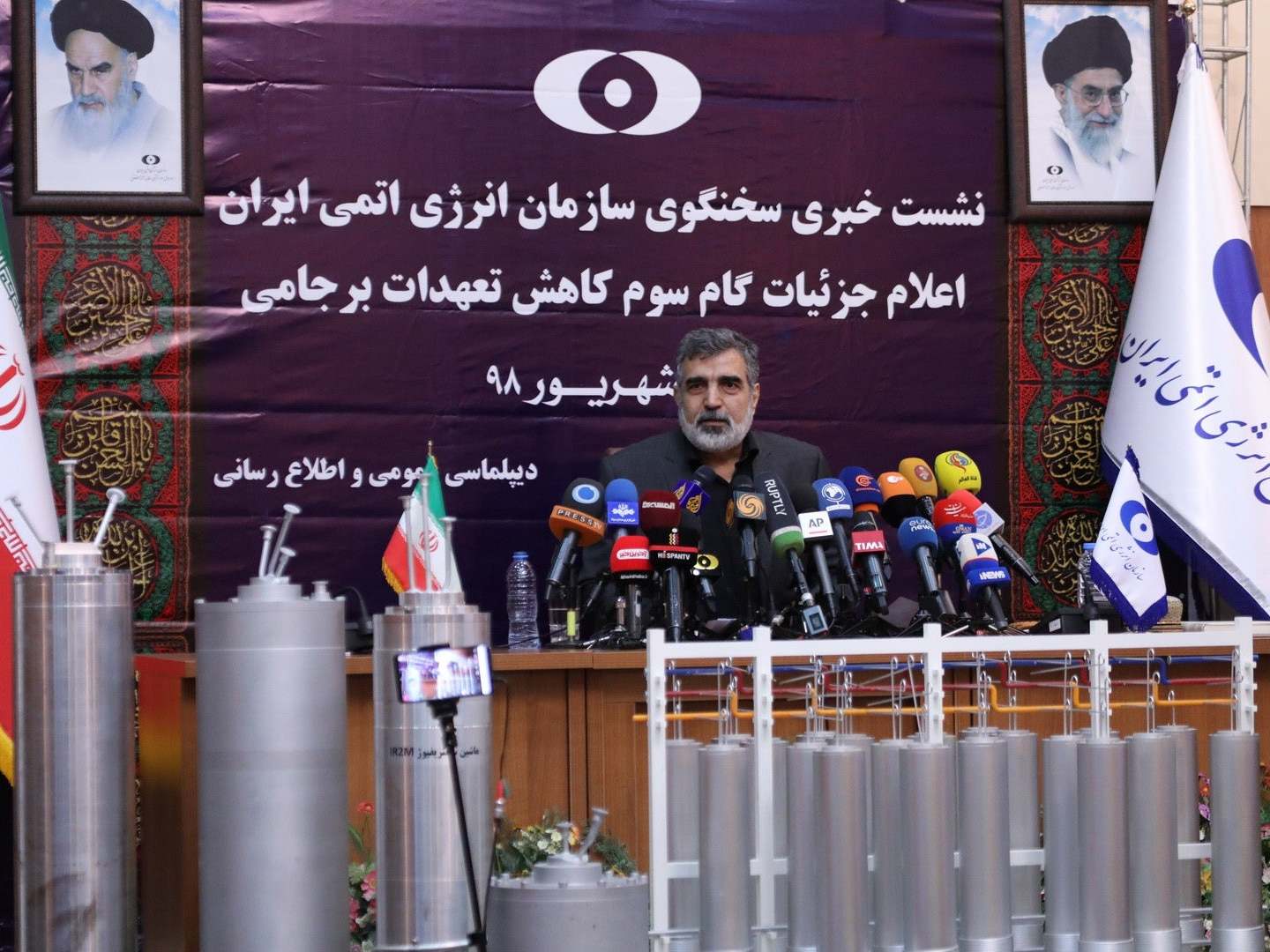 Behrouz Kamalvandi made the announcement, broadcast on live TV, from a podium with advanced centrifuges standing in the foreground