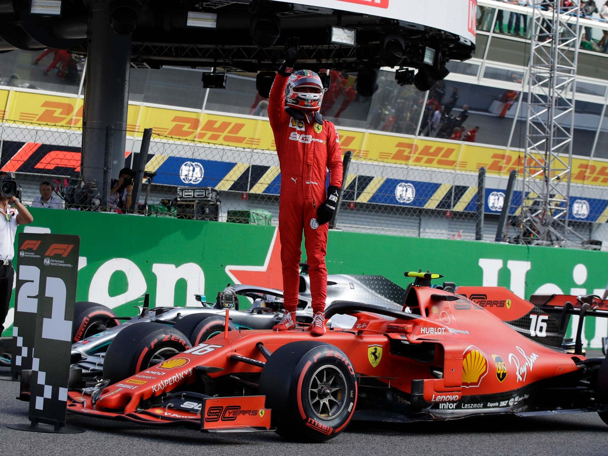 Ferrari driver Charles Leclerc salutes fans