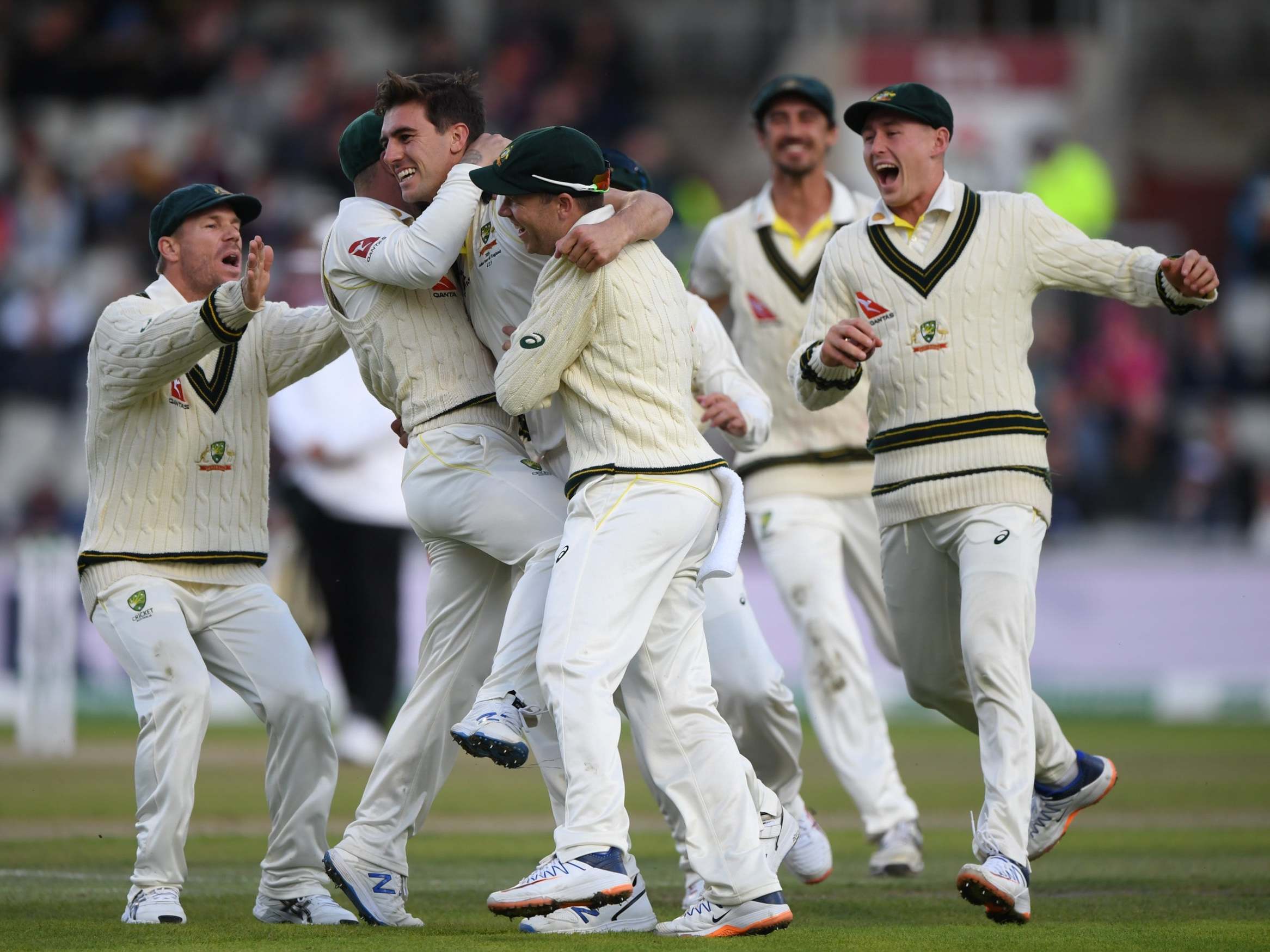 Australia celebrate taking the late wicket of Joe Root