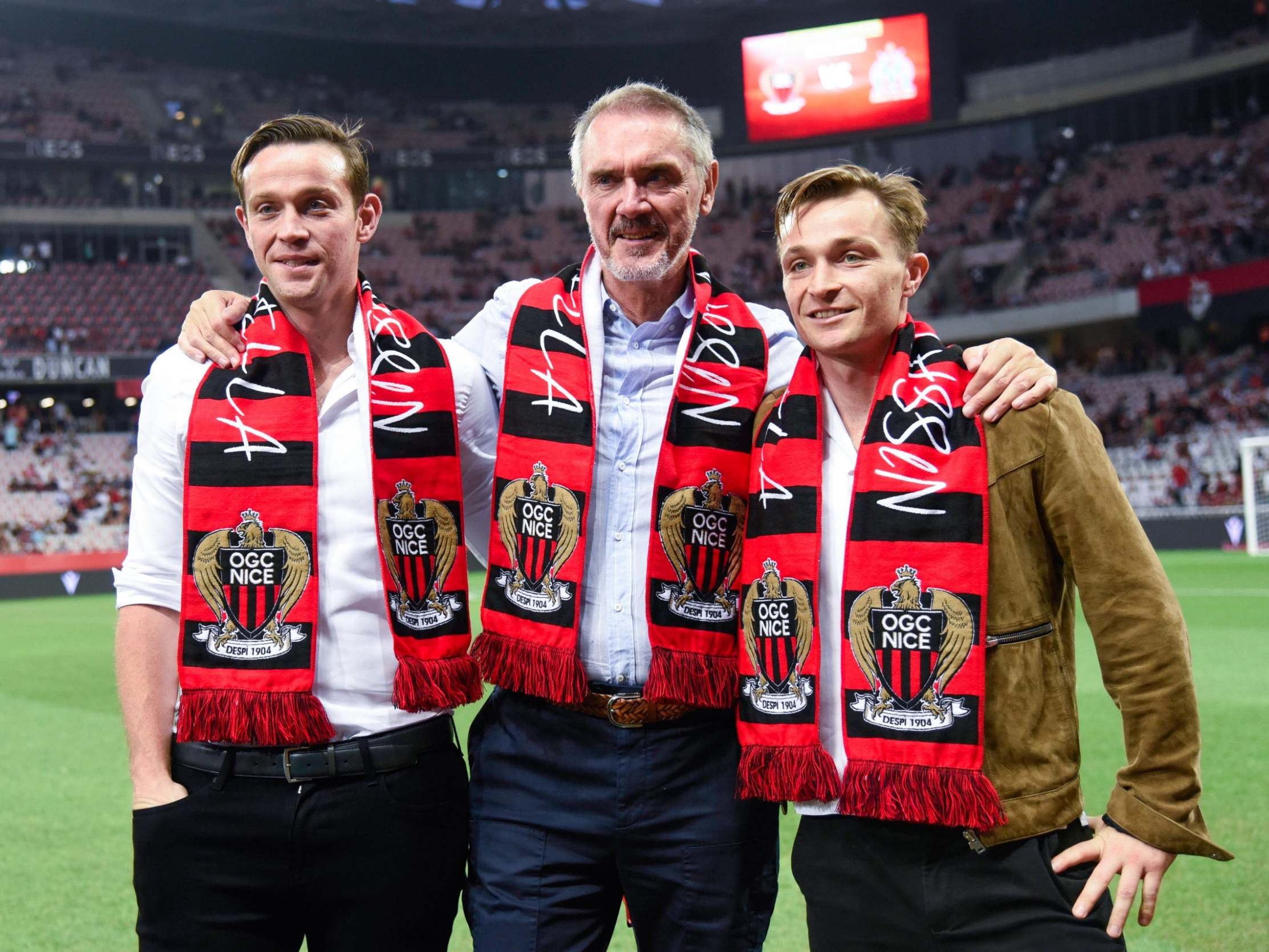 Bob Ratcliffe and his sons on the pitch at Nice