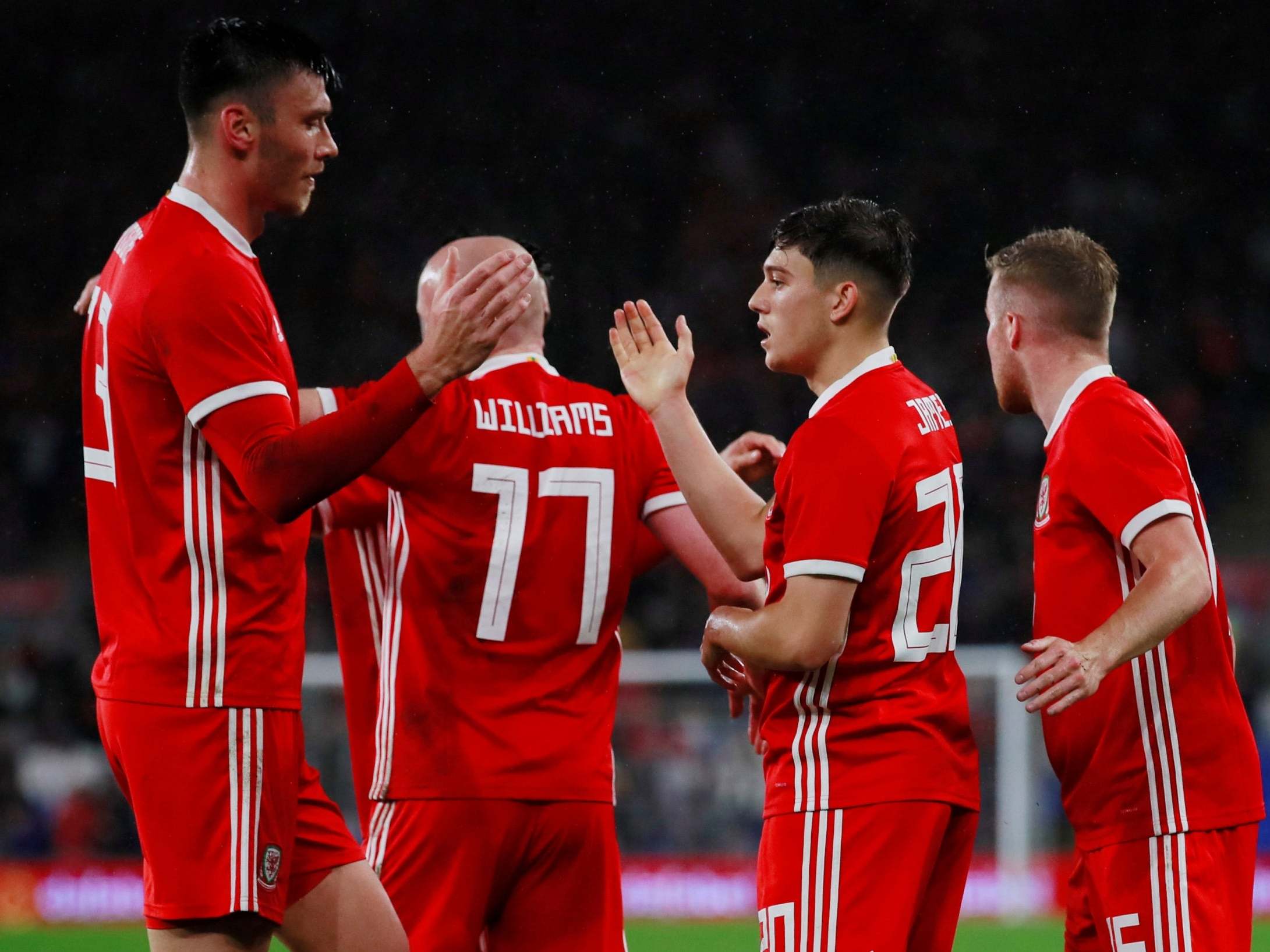 Daniel James is congratulated by teammates