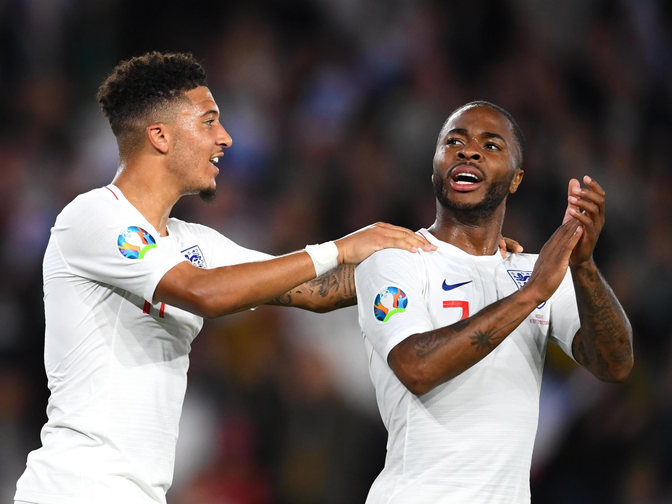 Raheem Sterling and Jadon Sancho celebrate