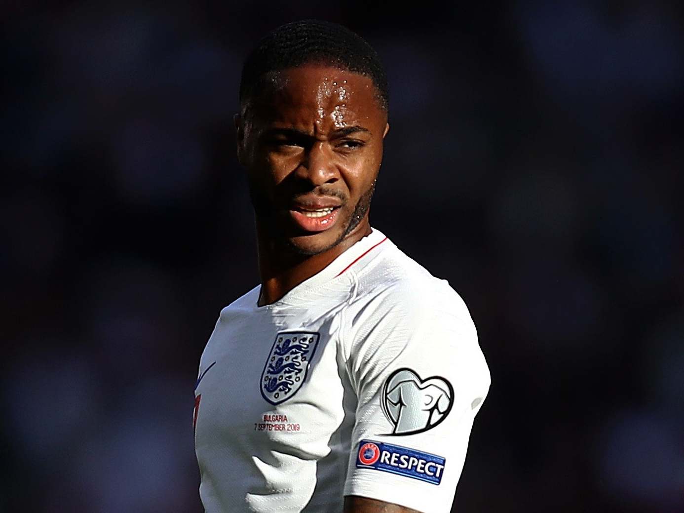 Raheem Sterling of England looks on