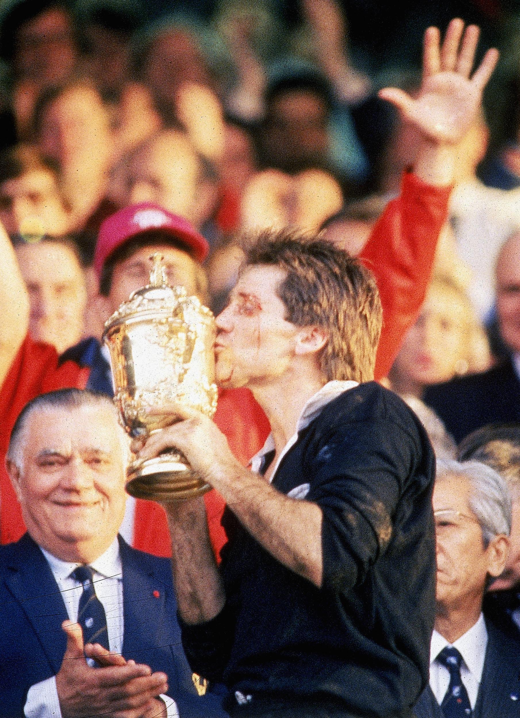 David Kirk of New Zealand kisses  the Willam Webb Ellis Trophy after  the 1987 Rugby World Cup Final match between New Zealand and France at Eden Park on June 20, 1987 in Auckland, New Zealand. (Ross Land/Getty Images)