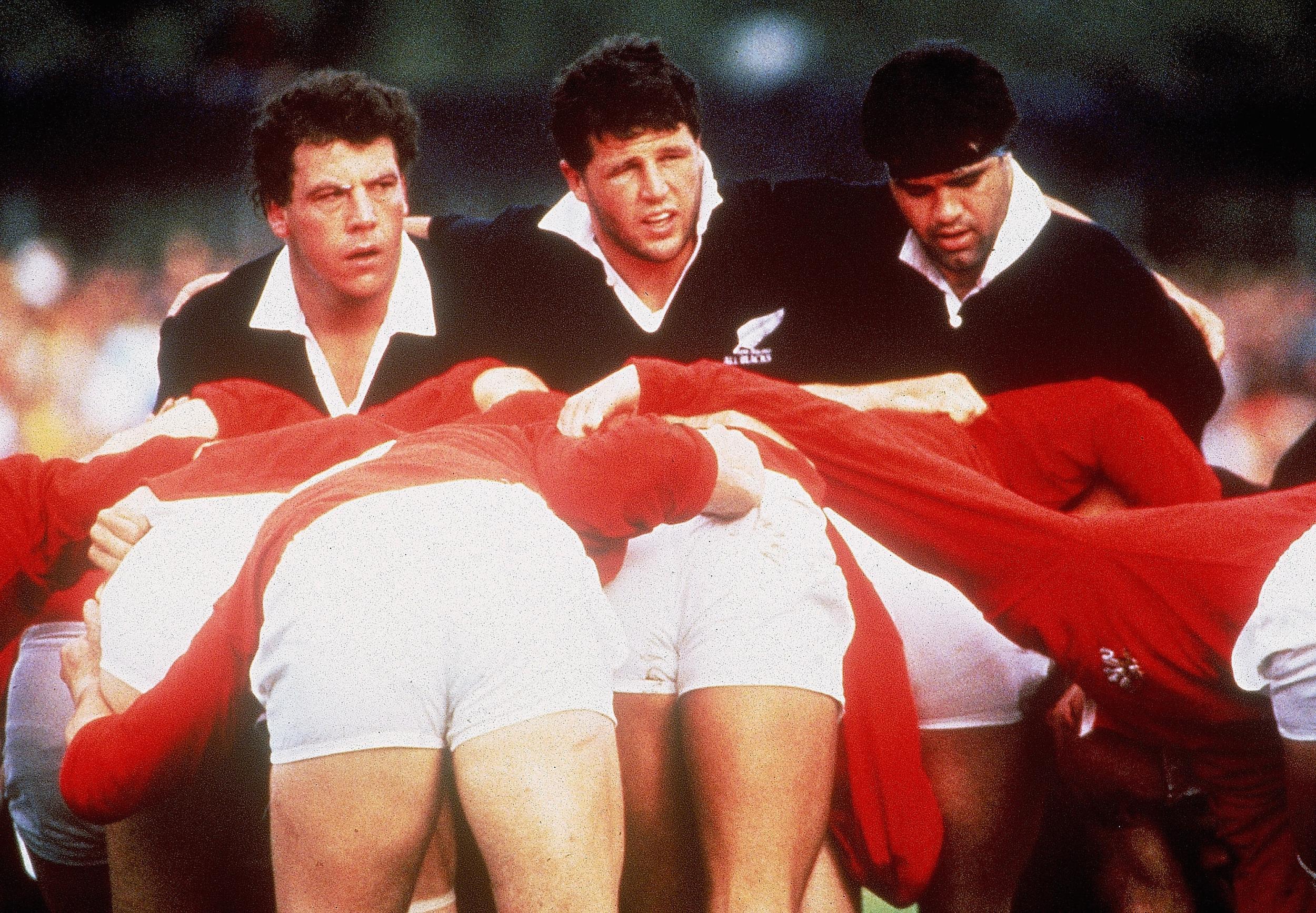 John Drake, Sean Fitzpatrick and Steve McDowell of New Zealand prepare to pack down for a scrum during the 1987 Rugby World Cup Semi-Final match between New Zealand and Wales at Ballymore Stadium on June 14, 1987 in Brisbane, Australia. (Ross Land/Getty Images)