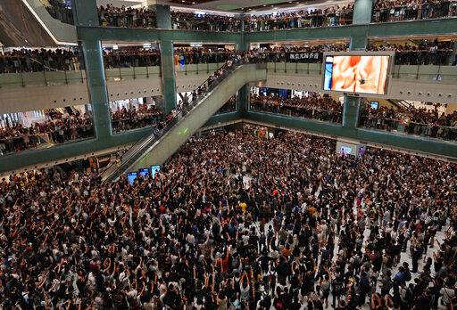 Hong Kong citizens sing protest karaoke at a city shopping mall