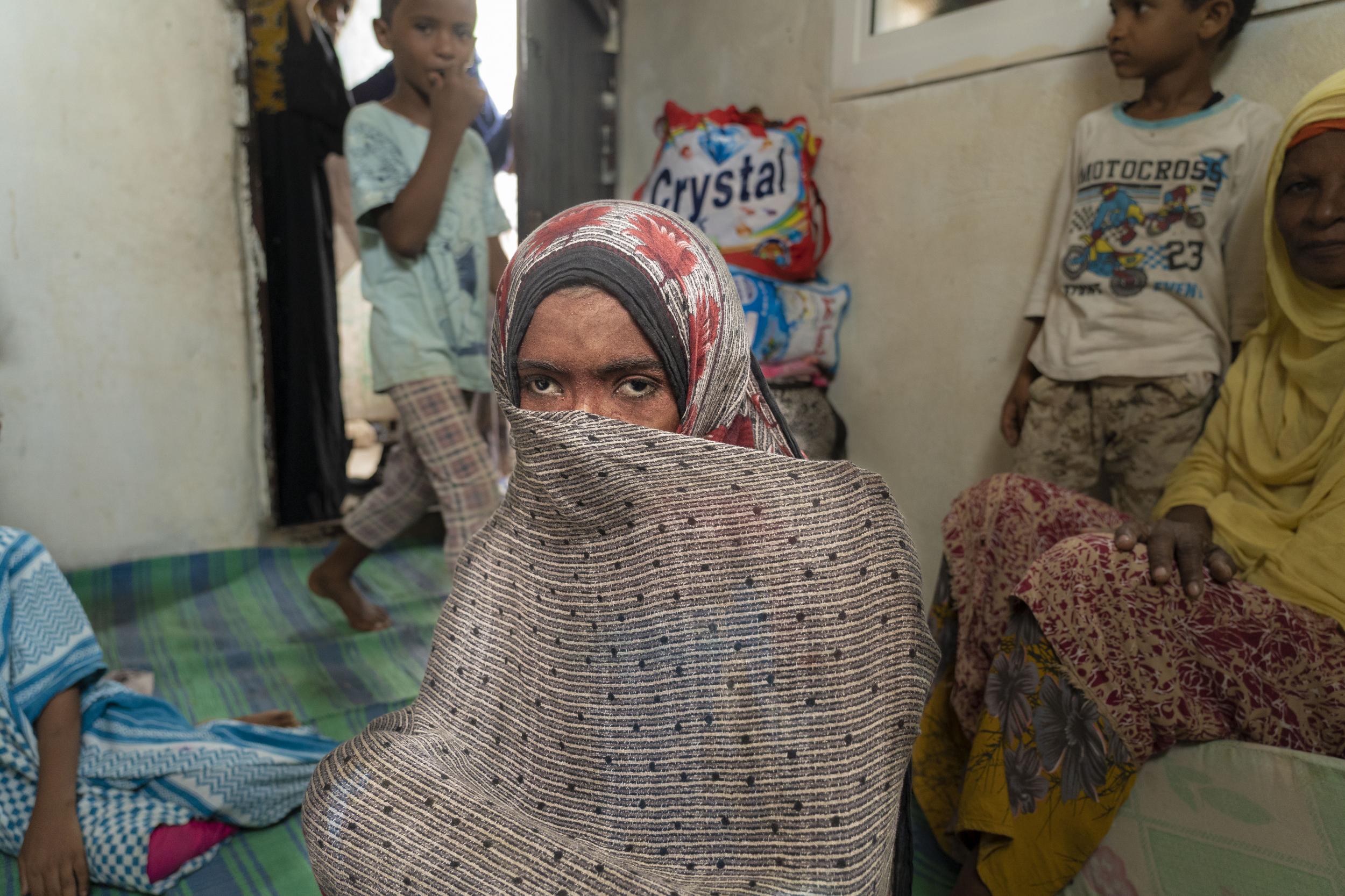 Nagwa, 19, in the home she shares with more than 40 members of her family in Mahra