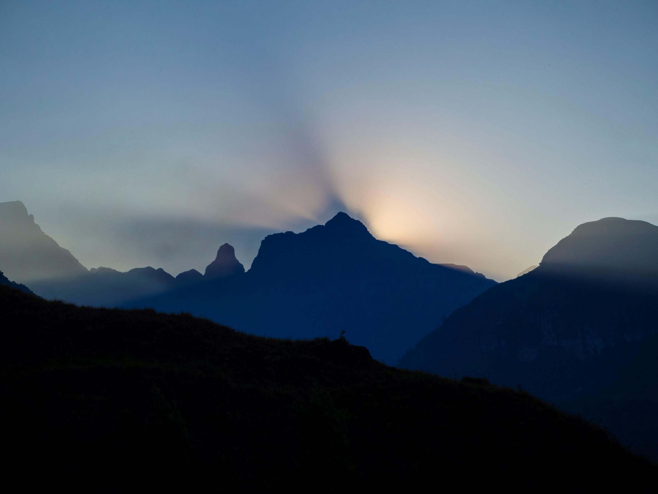 The sun setting behind Cathedral Peak