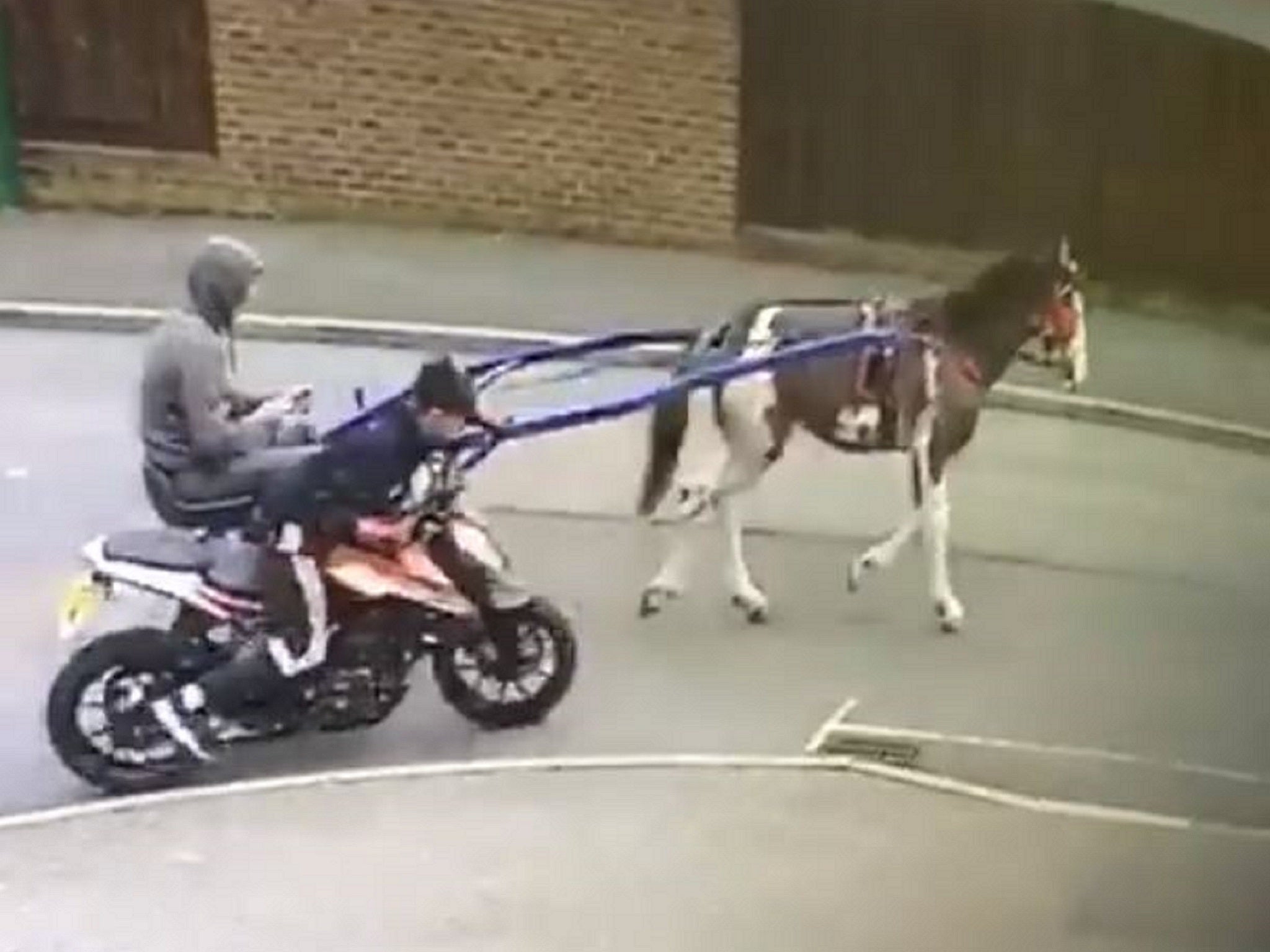 Police are investigating after CCTV footage showed two people allegedly towing a stolen motorbike away by horse in Dartford, Kent, 10 September 2019.