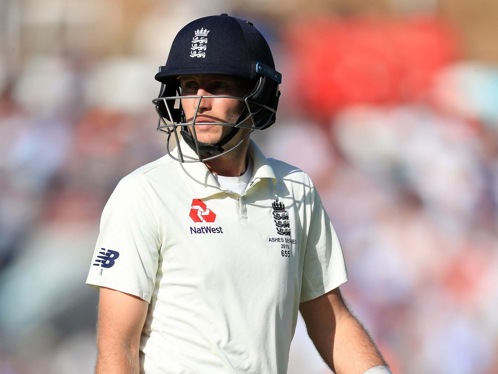 England's Joe Root walks off