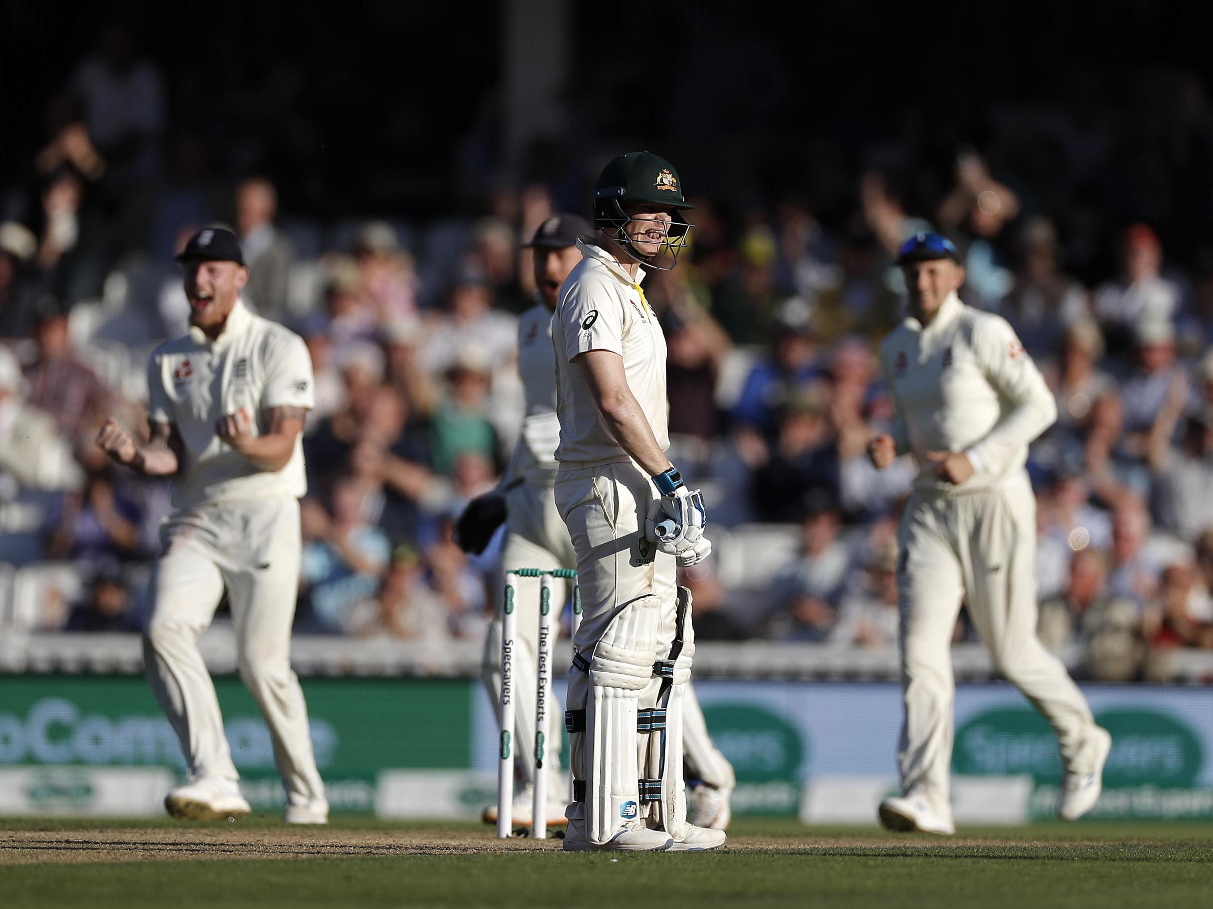 Steve Smith looks on as England celebrate his dismissal