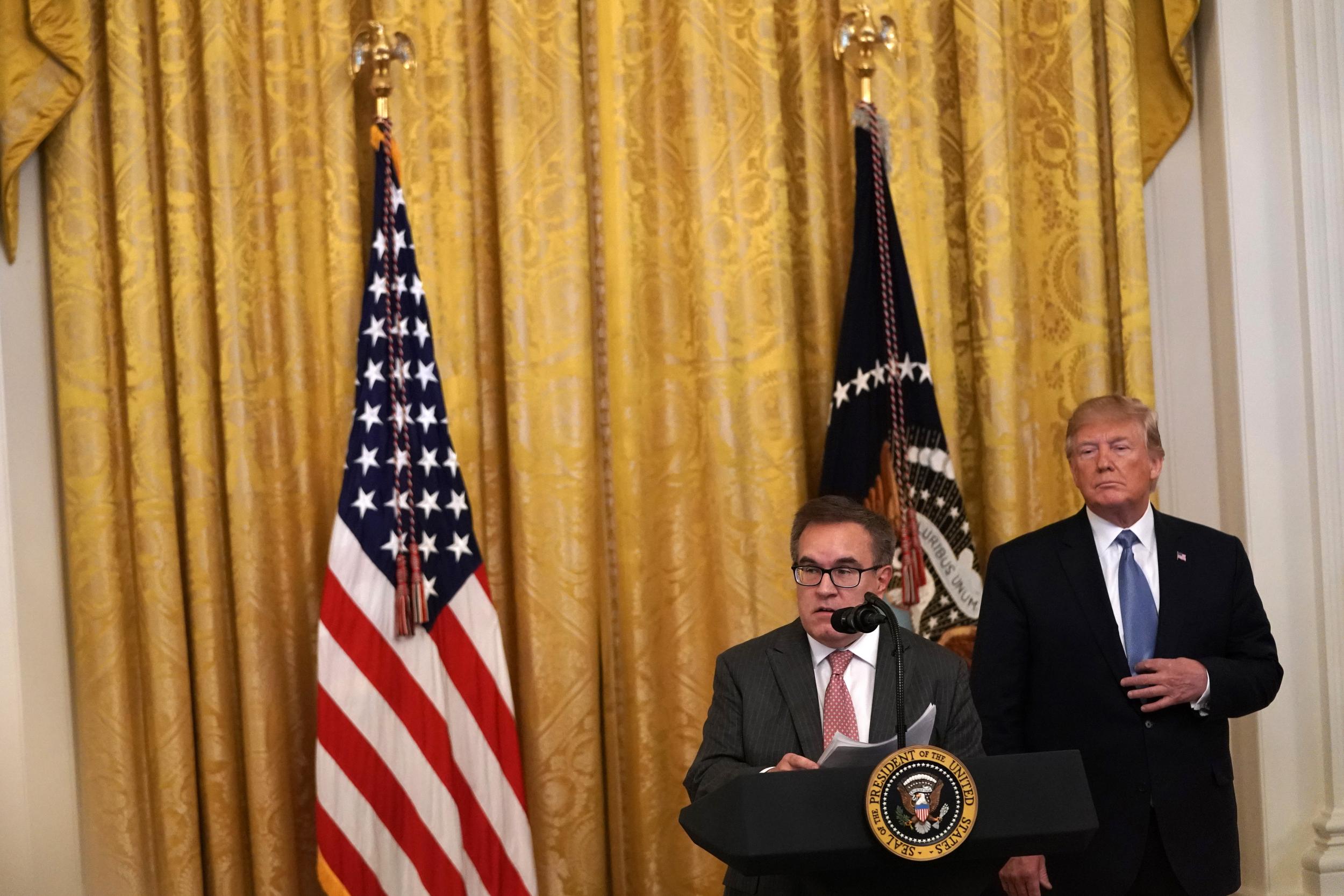 EPA Administrator Andrew Wheeler speaks as President Donald Trump looks on.