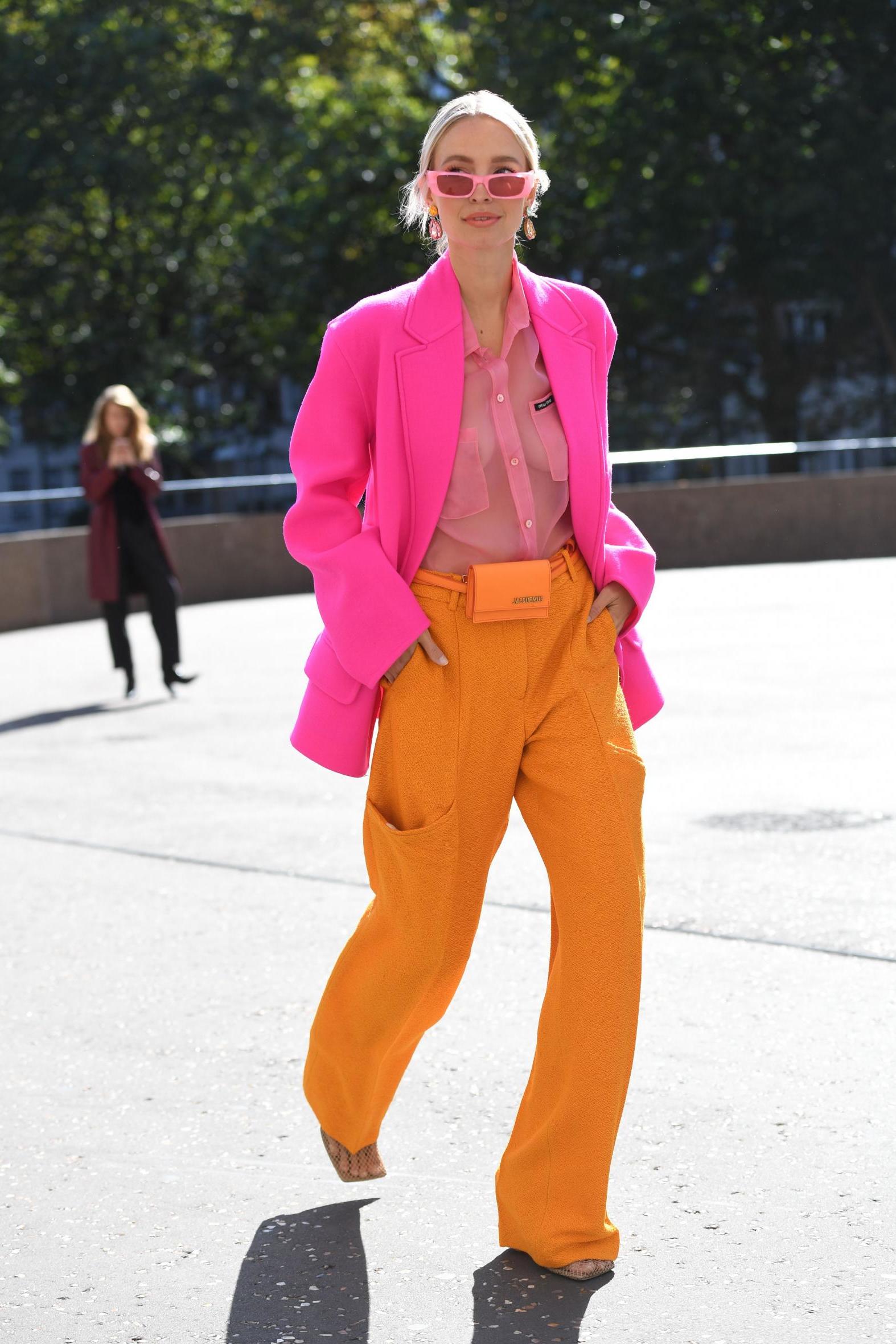 Fashion blogger Leonie Hanne shows her style cred with this vibrant pink-orange suit.
