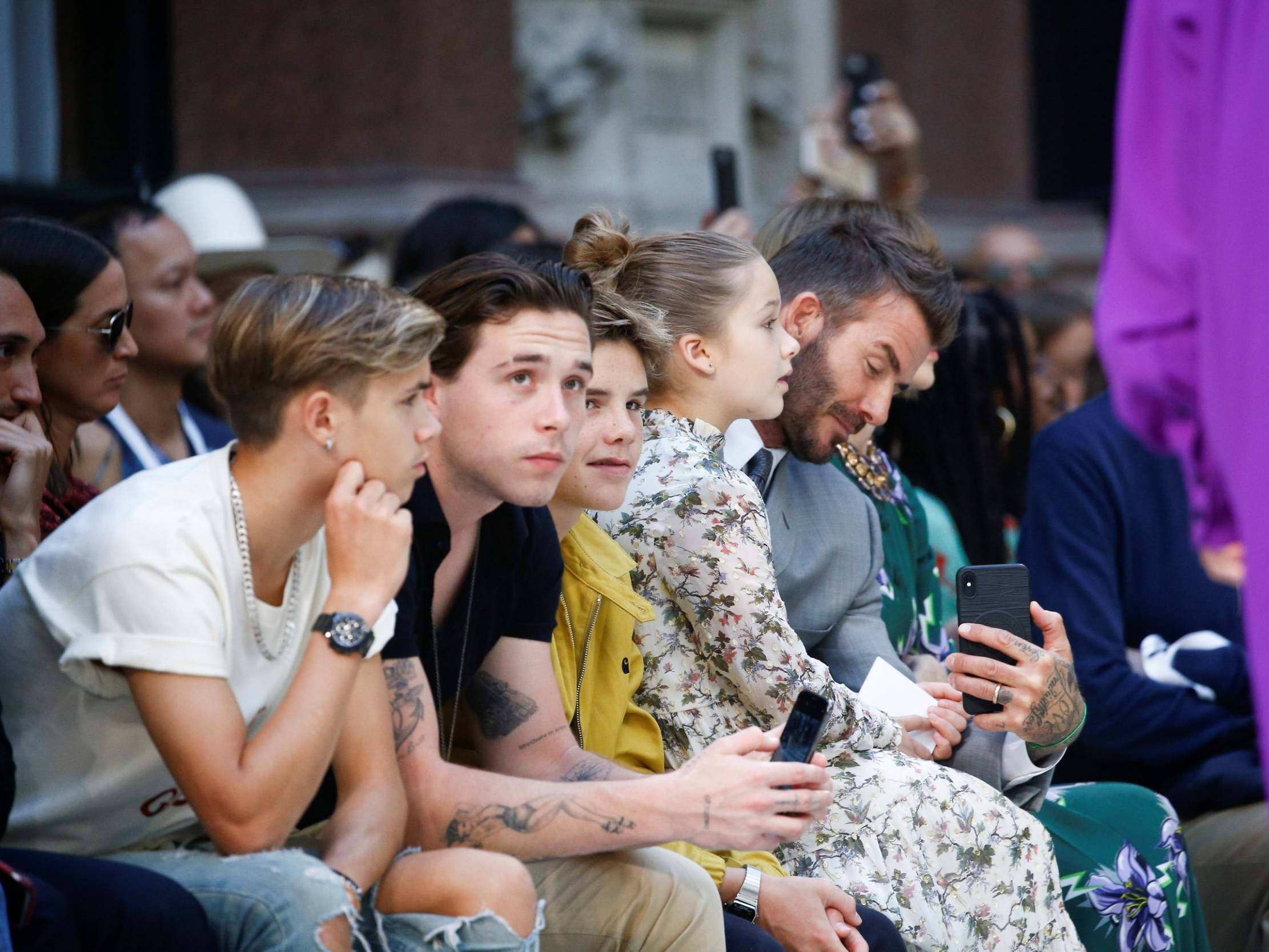 David Beckham and his children Brooklyn, Romeo, Cruz and Harper were seated front row in support of their mum