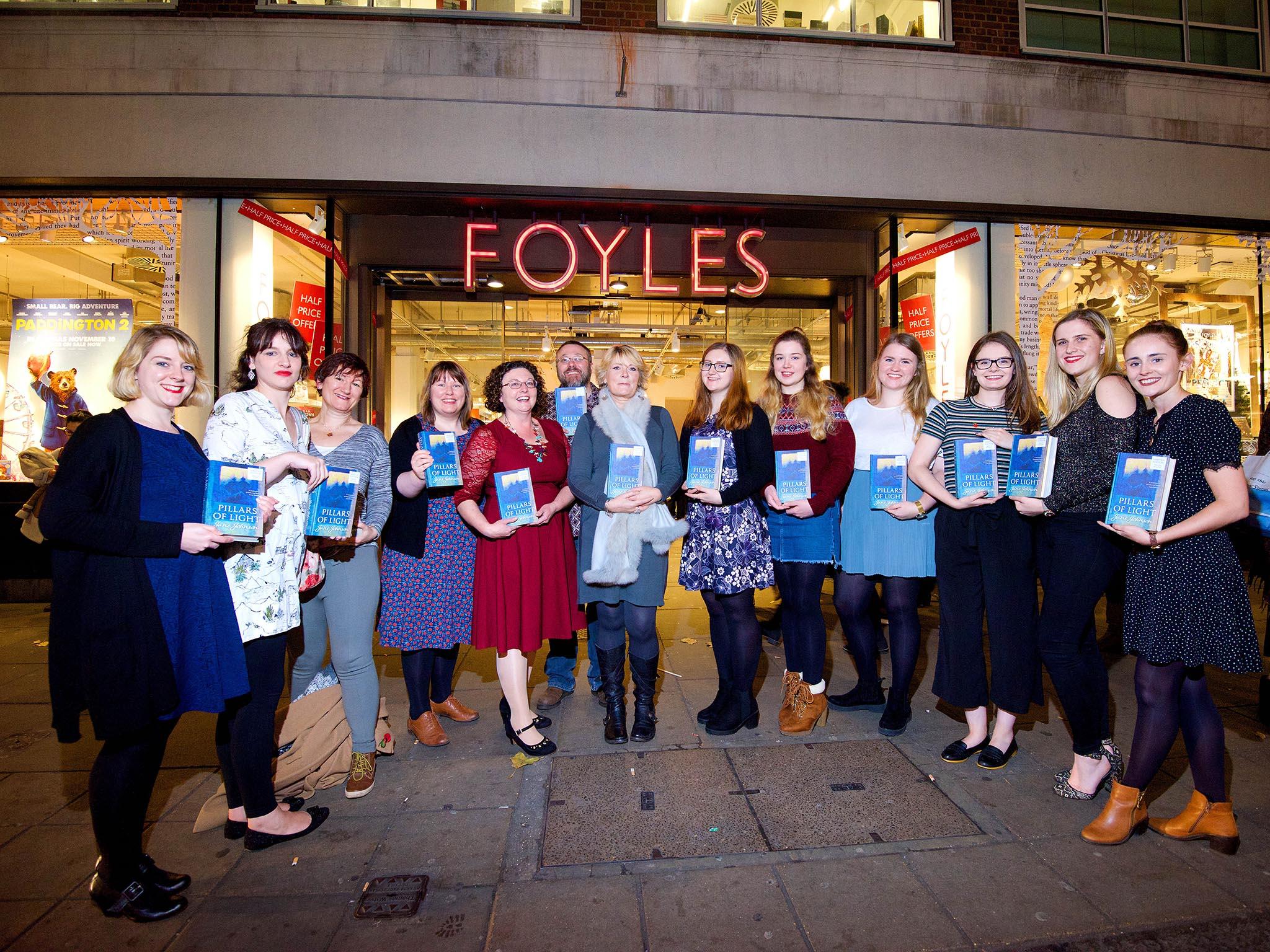 Debbie Williams, centre left in red, and her team of students published Jane Johnson’s novel ‘Pillars of Light’