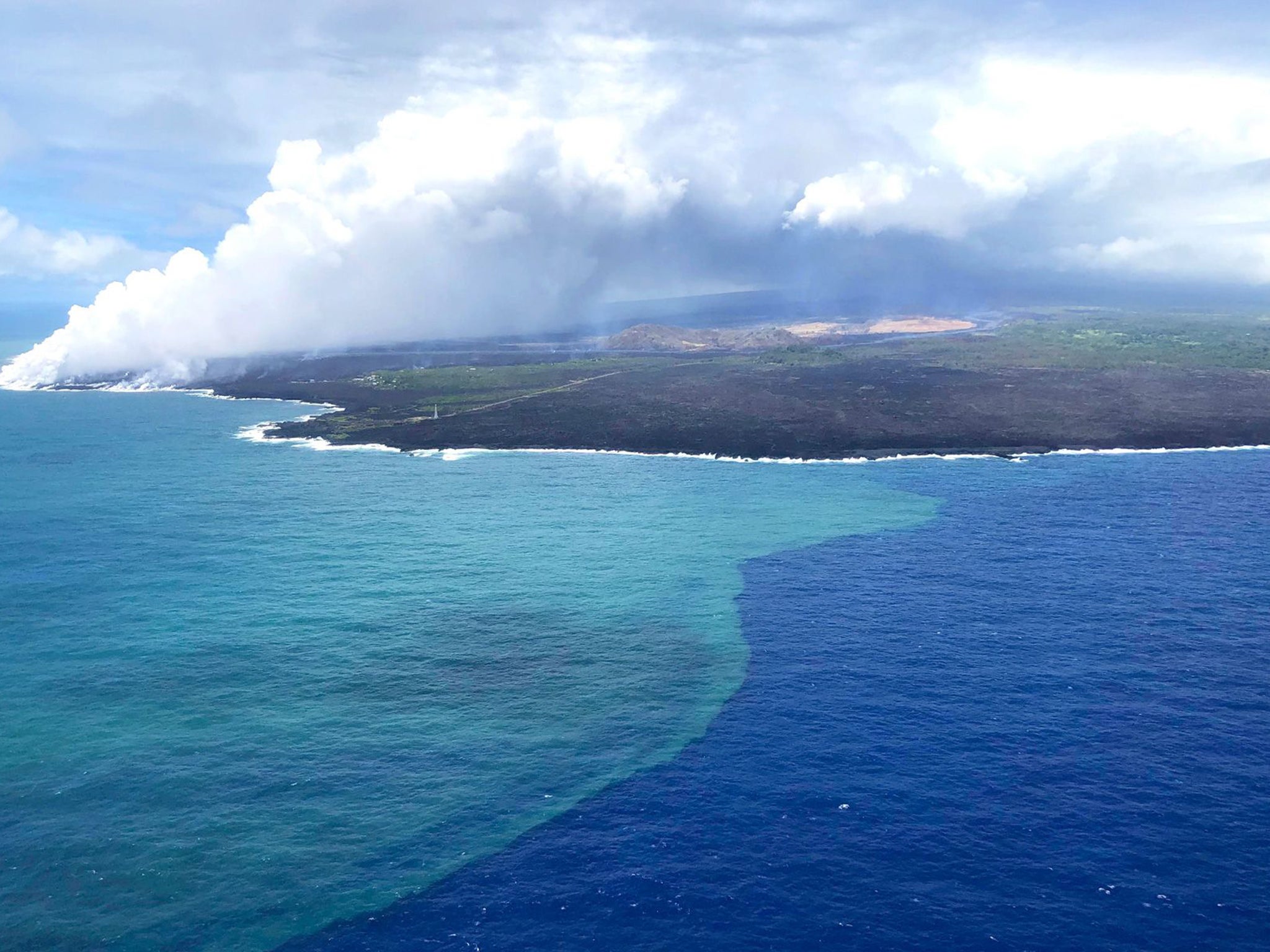 The bloom began three days after lava from Kilauea touched the sea