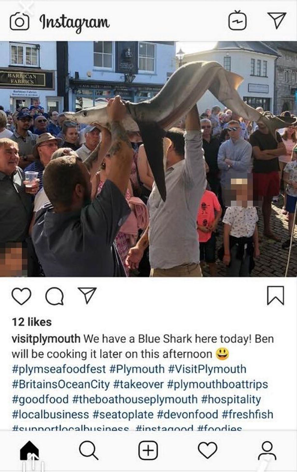 A photograph of the shark being held aloft was posted online on the official Visit Plymouth Instagram page